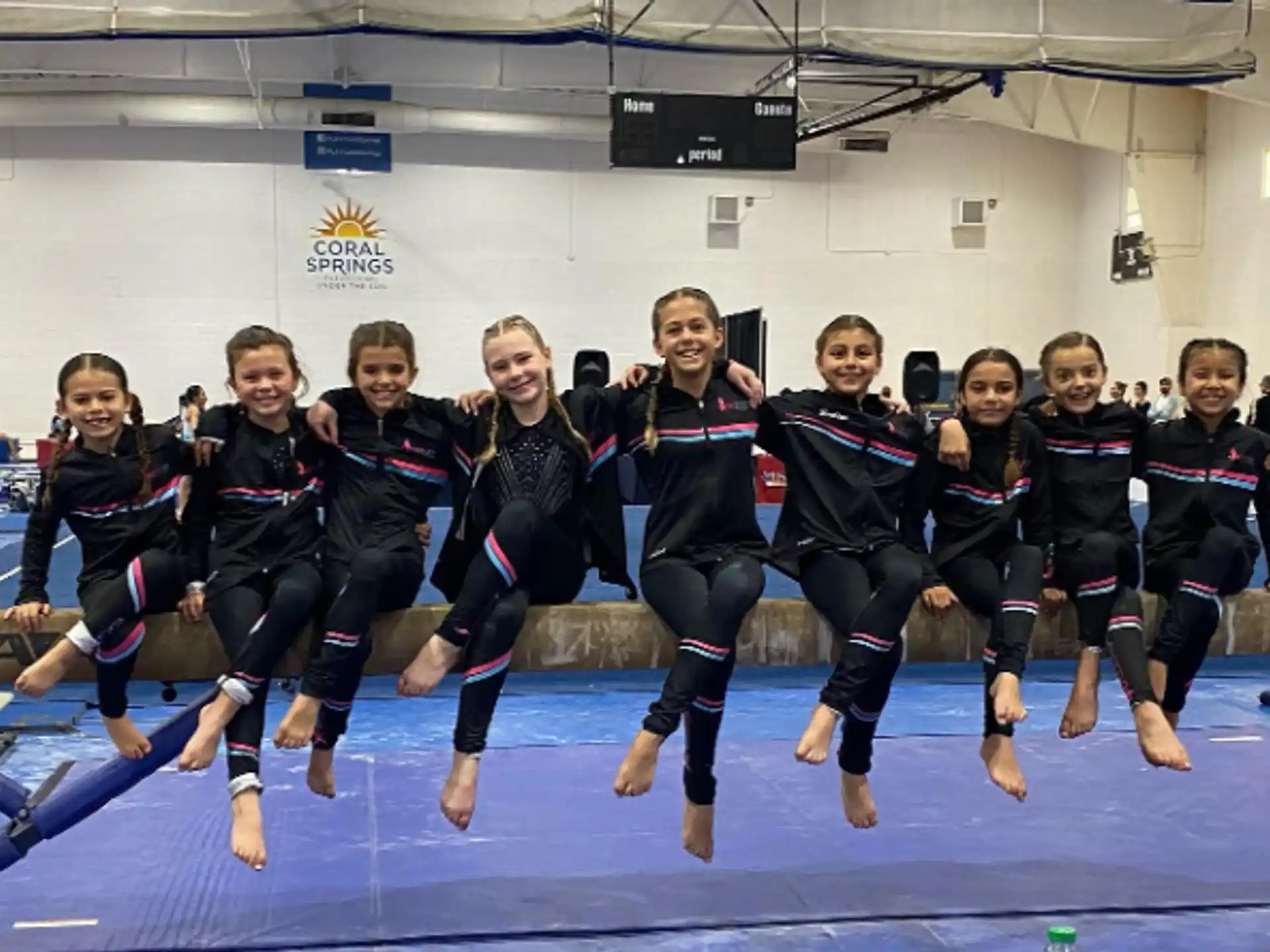 a group of girls in black uniforms
