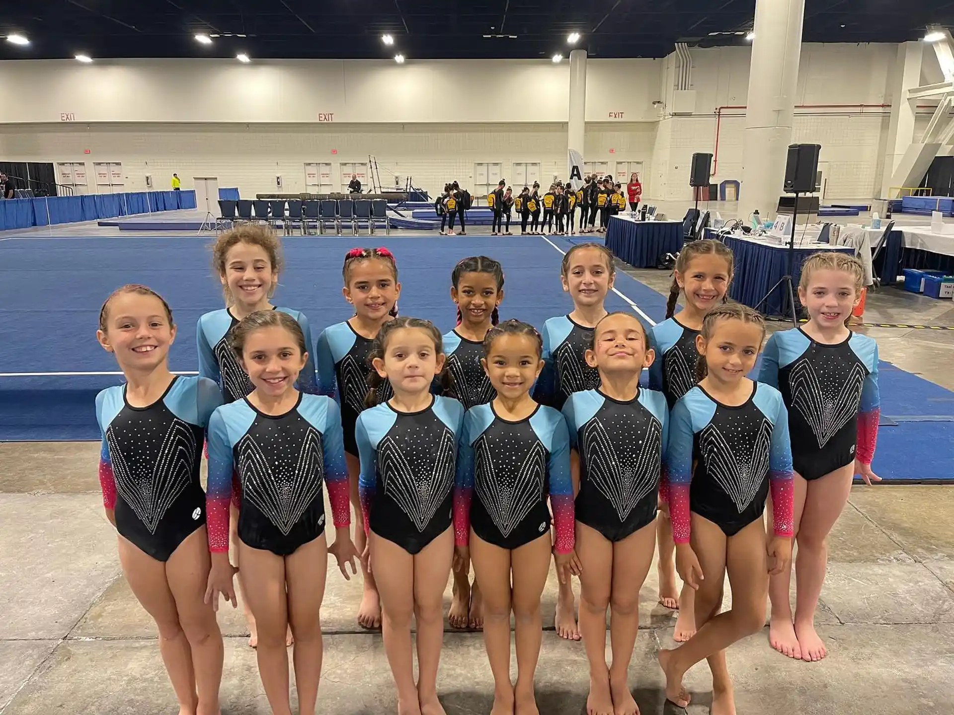 a group of girls in swimsuits posing for a photo