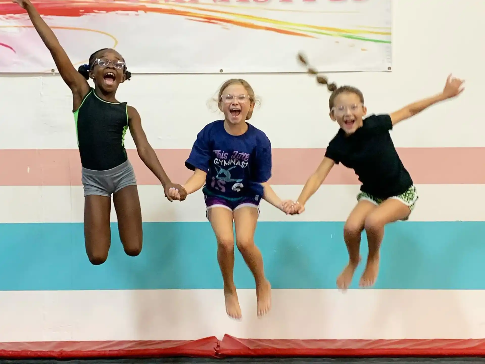 a group of girls jumping in the air