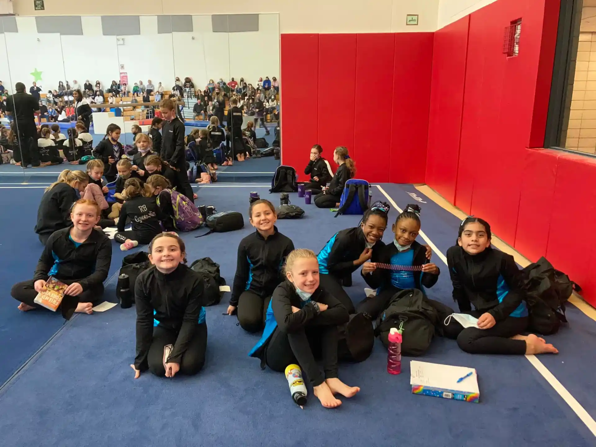 a group of people sitting on the floor