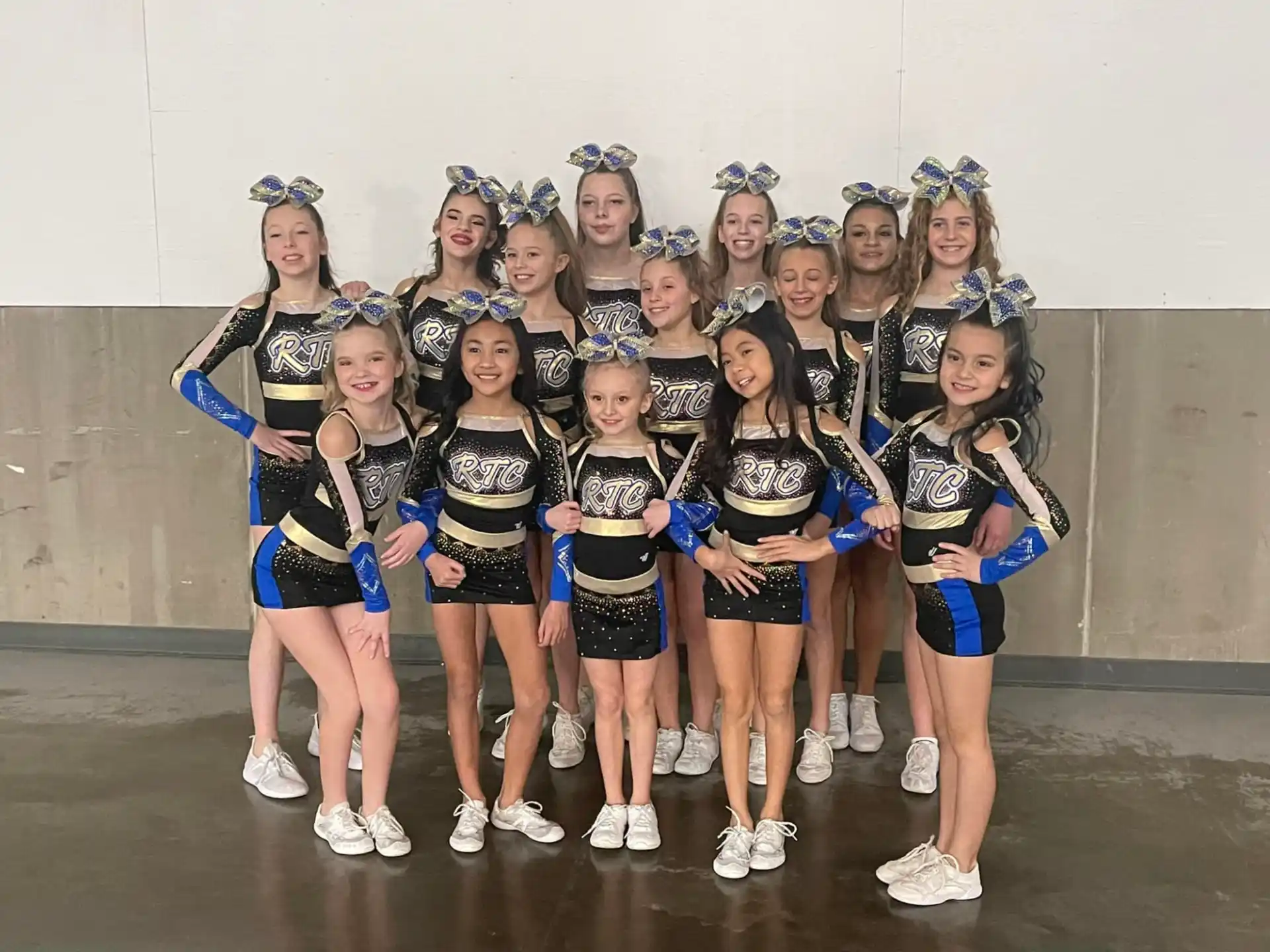 a group of cheerleaders posing for a photo