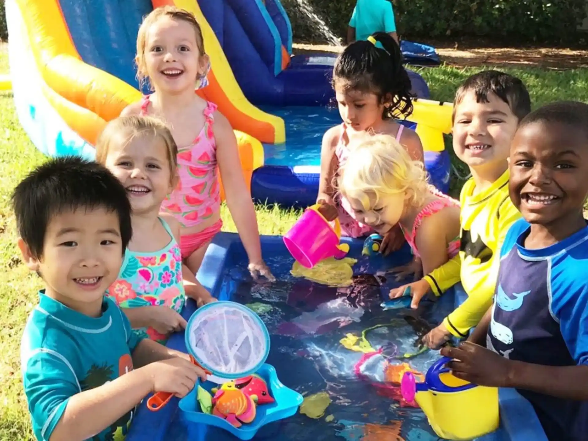 a group of children playing in a play area
