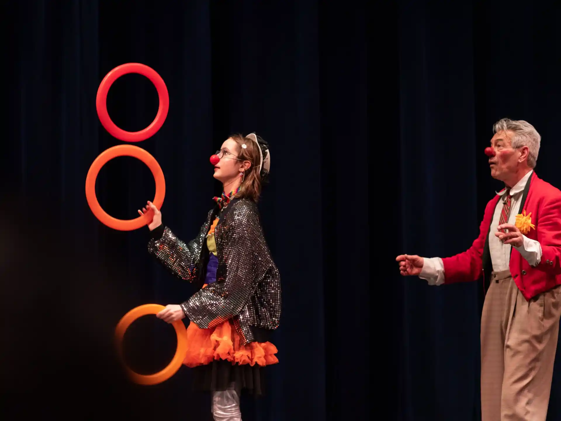 a man and woman on stage