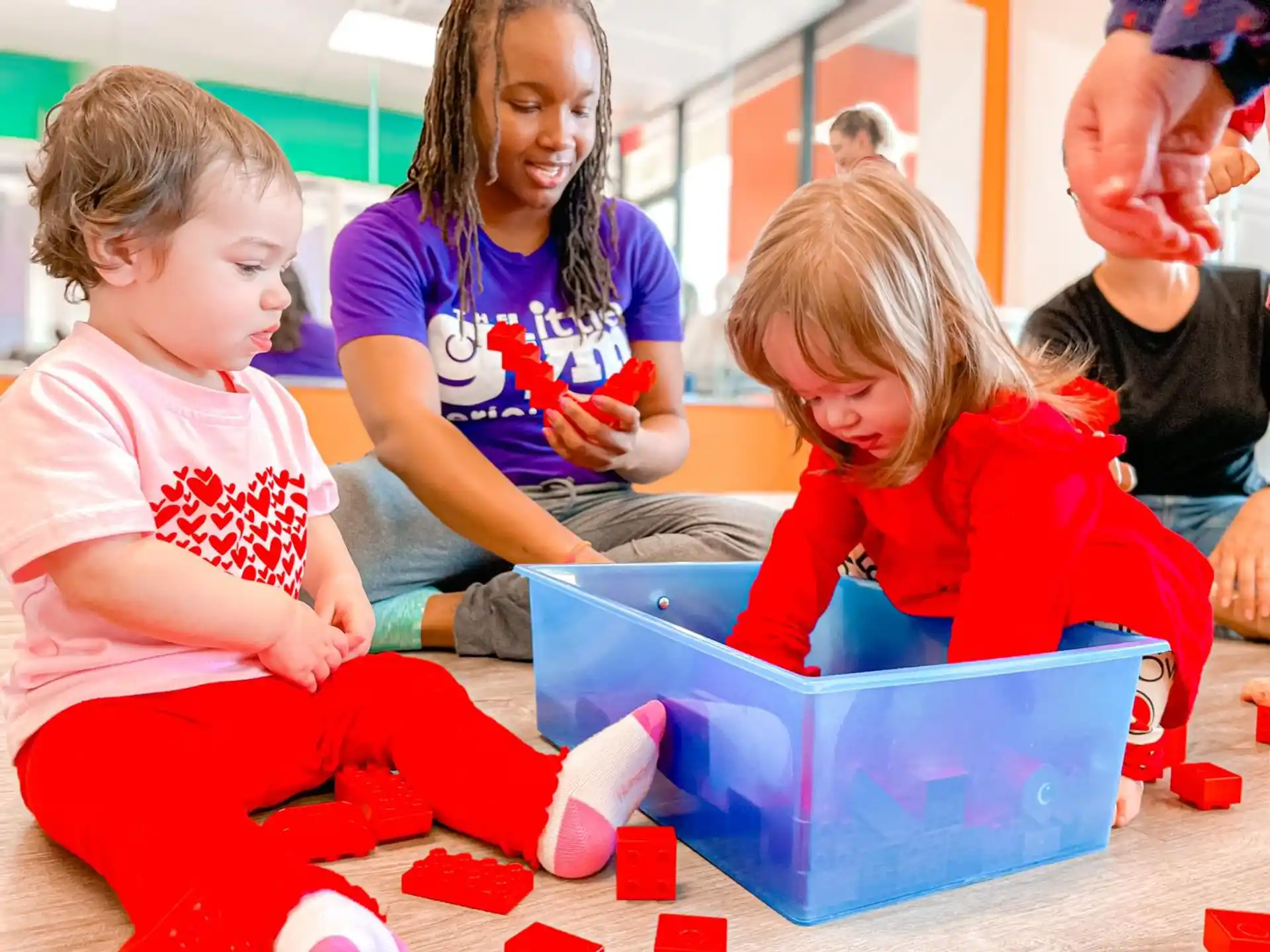 a group of children playing with toys