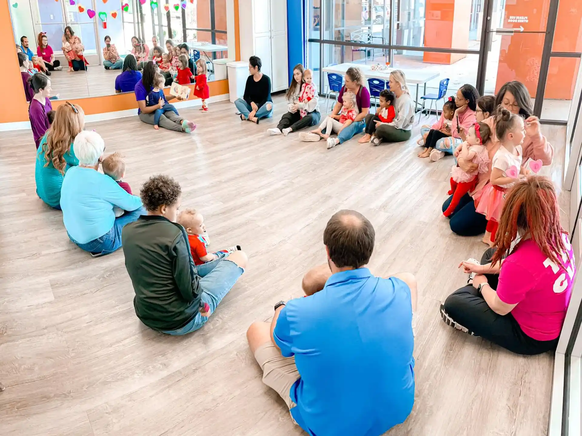 a group of people sitting on the floor