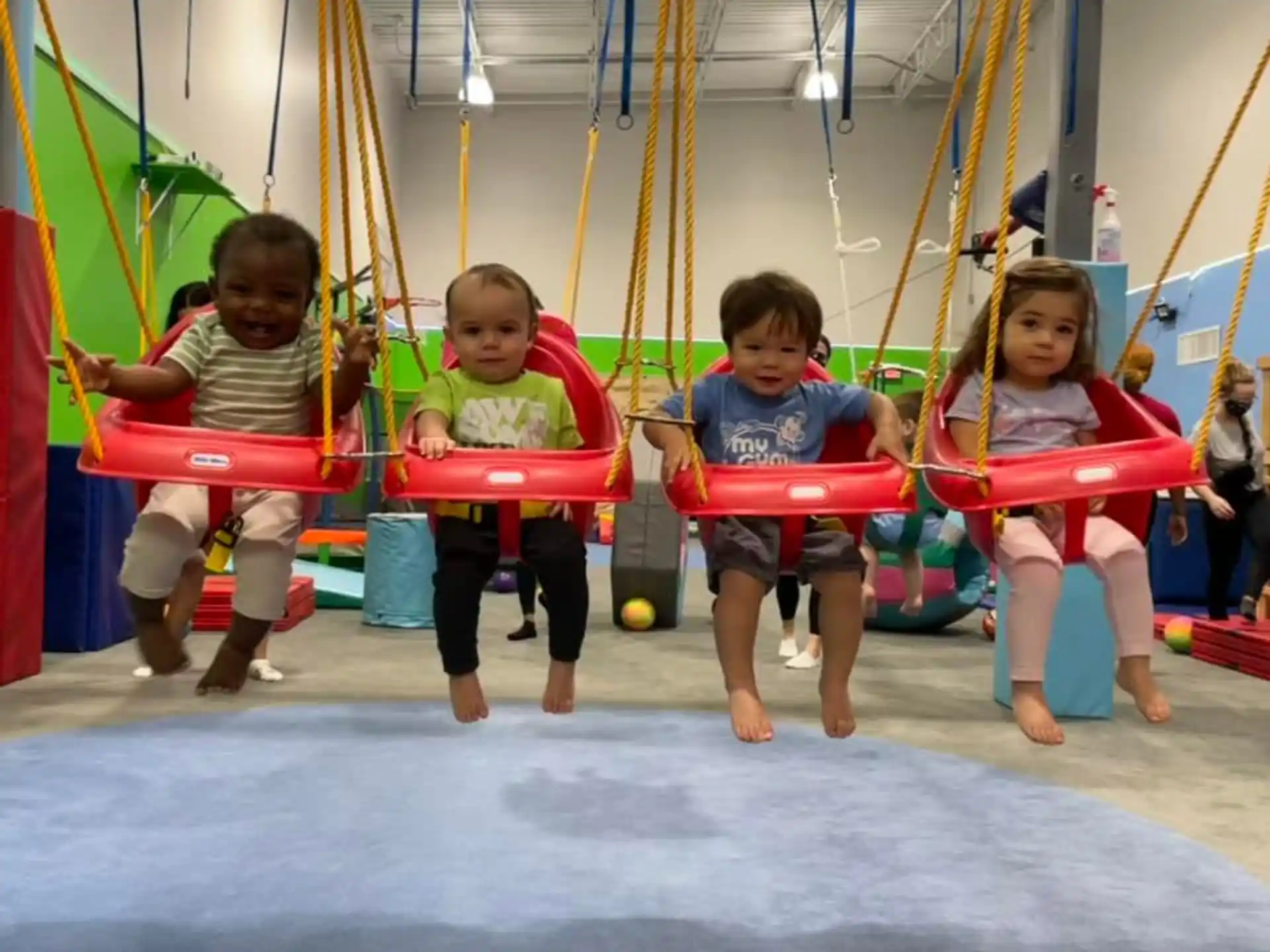 children on swings in a playground