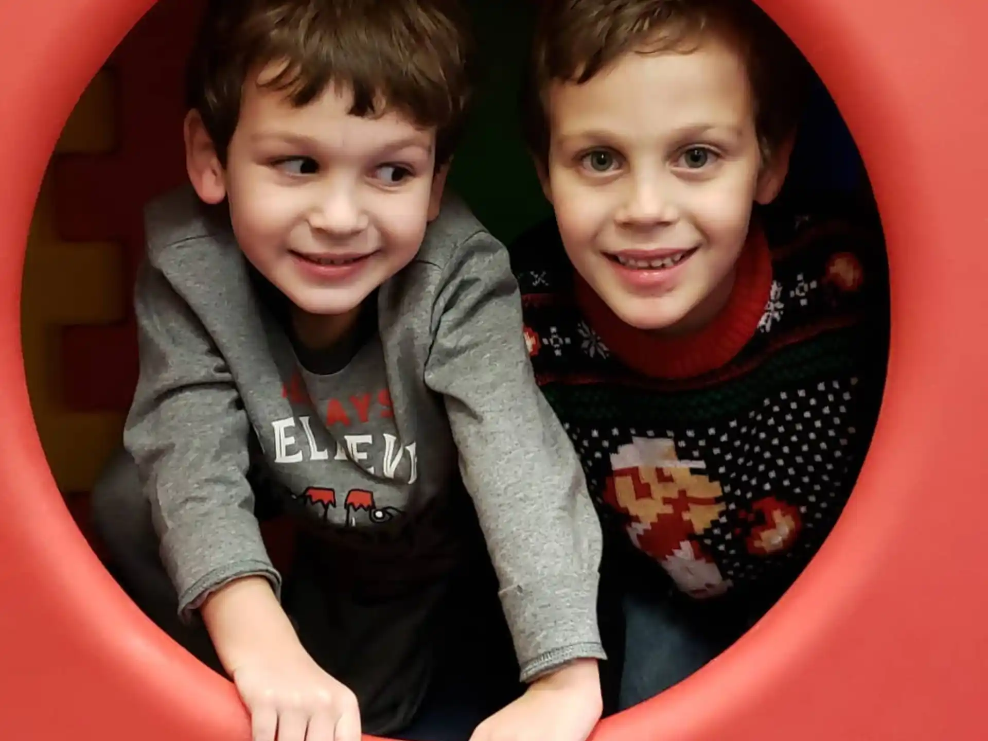 a couple of children posing for the camera