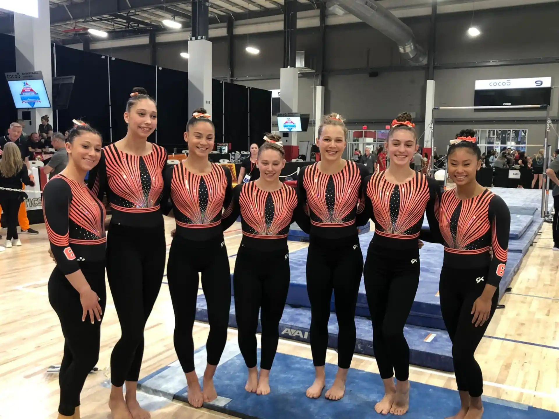 a group of women in matching outfits