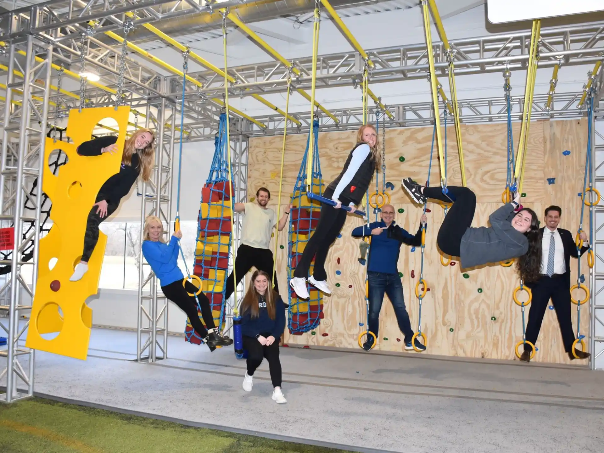 a group of people on a swing set