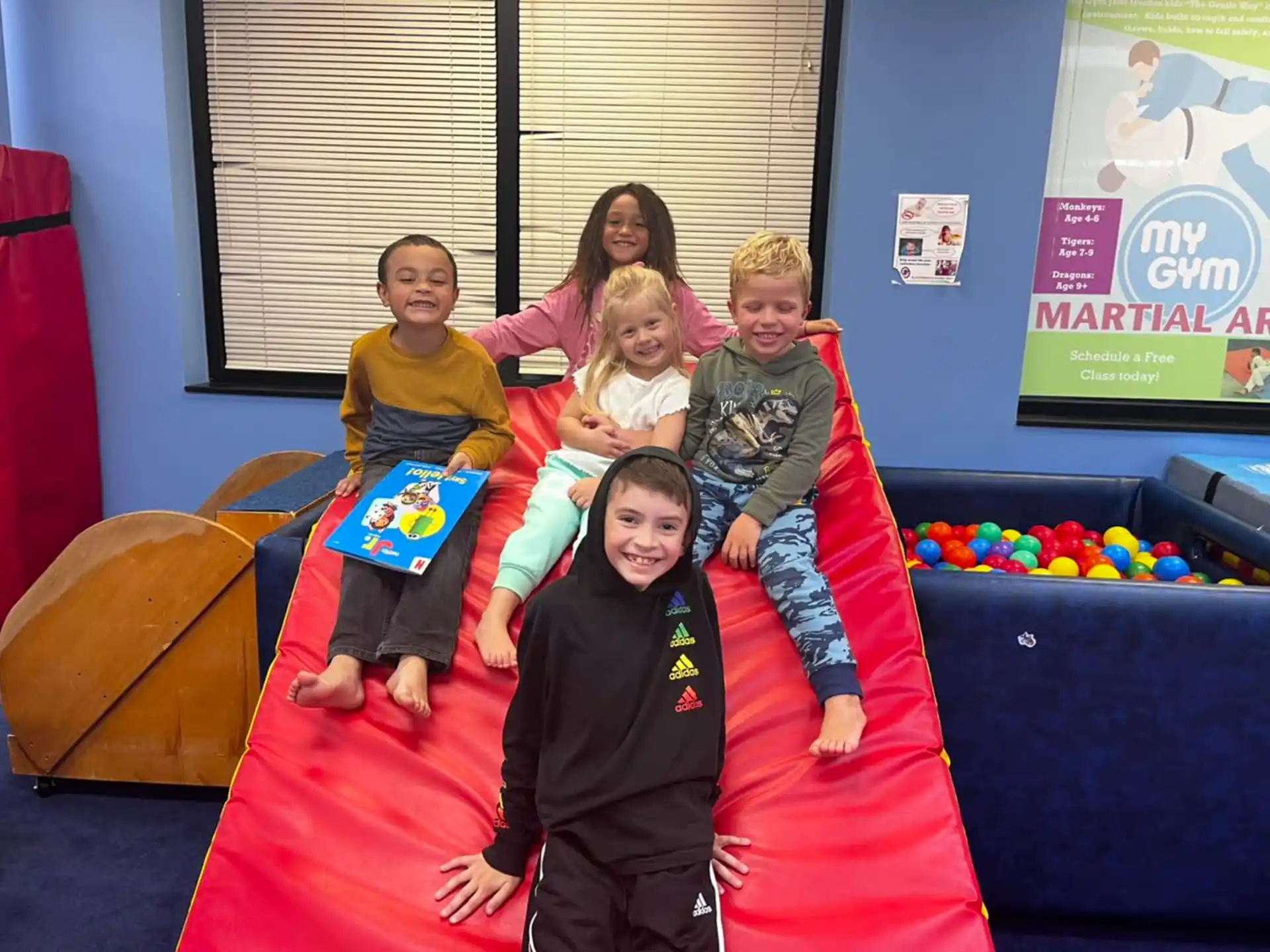 a group of children posing for a photo