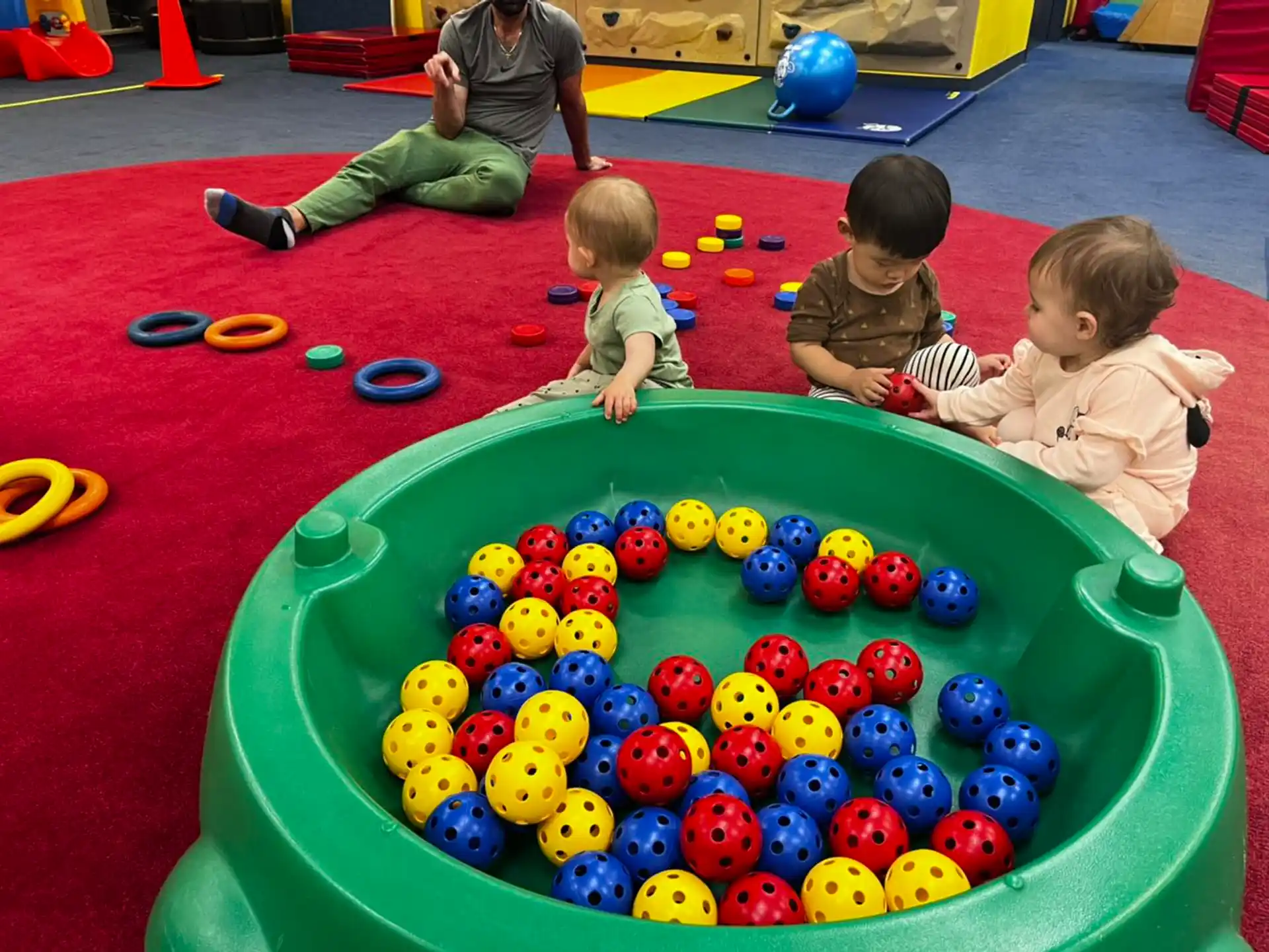 a group of kids playing with balls