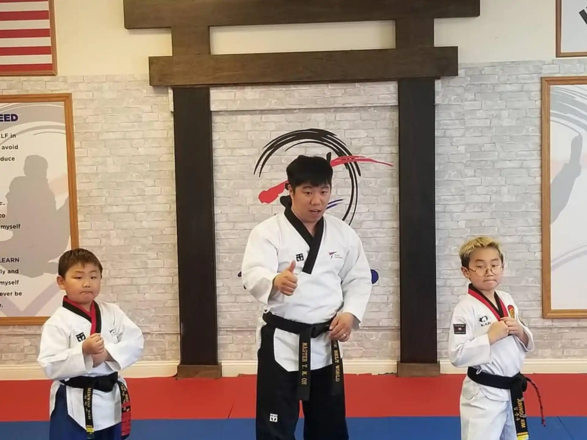 a group of kids in karate uniforms