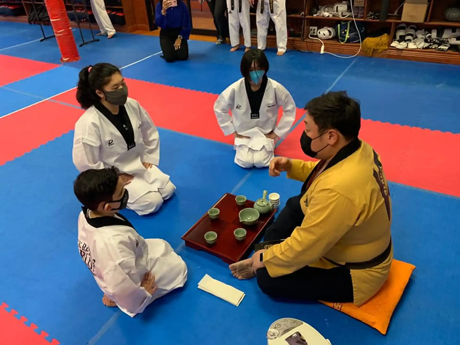 a group of people sitting on the floor playing a game