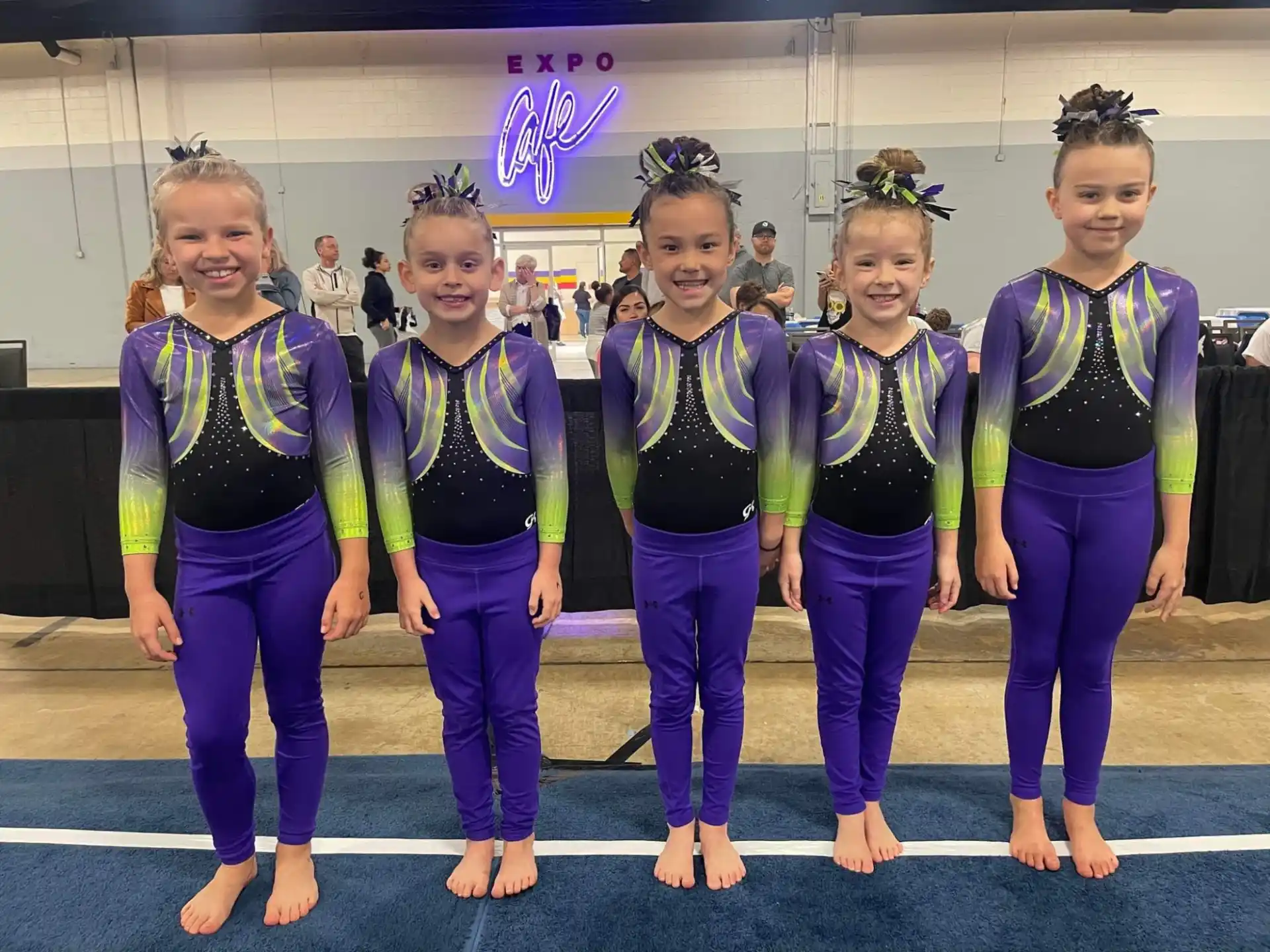 a group of women in matching outfits