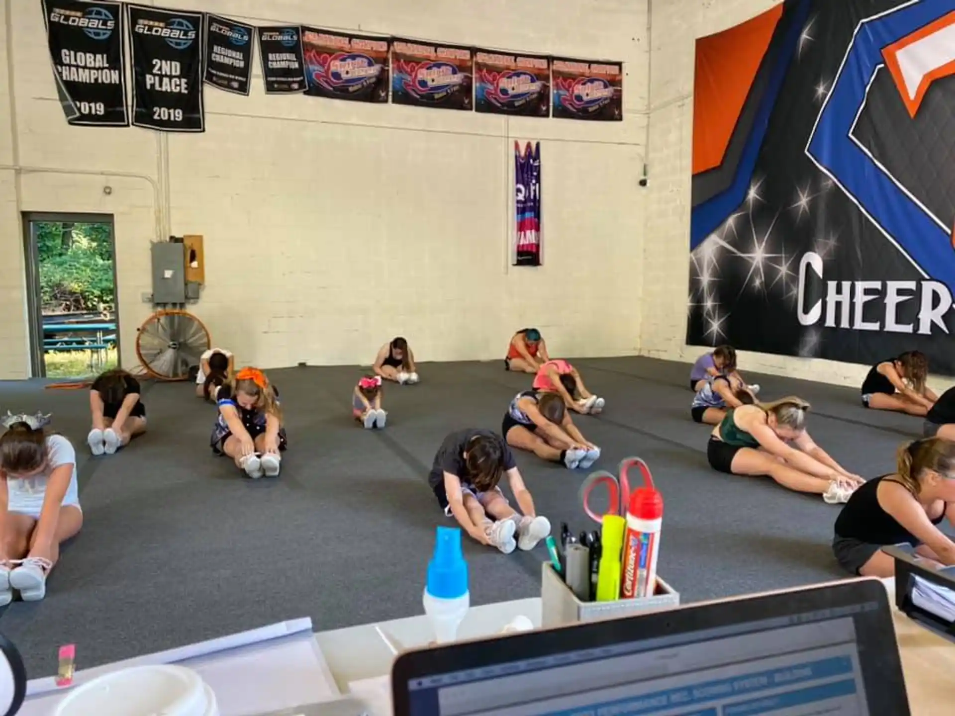 a group of people sitting on the floor in a room