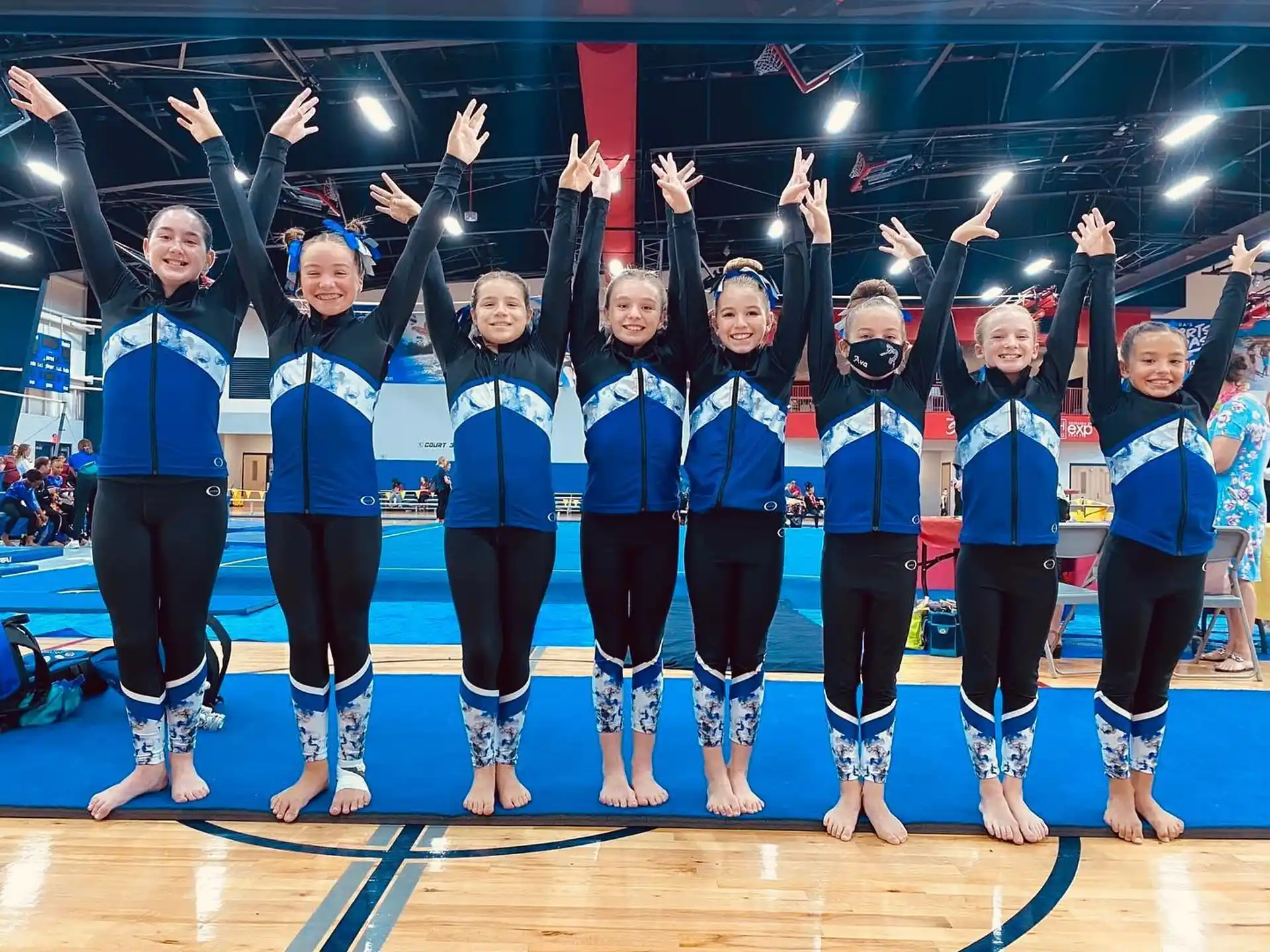 a group of women in blue uniforms