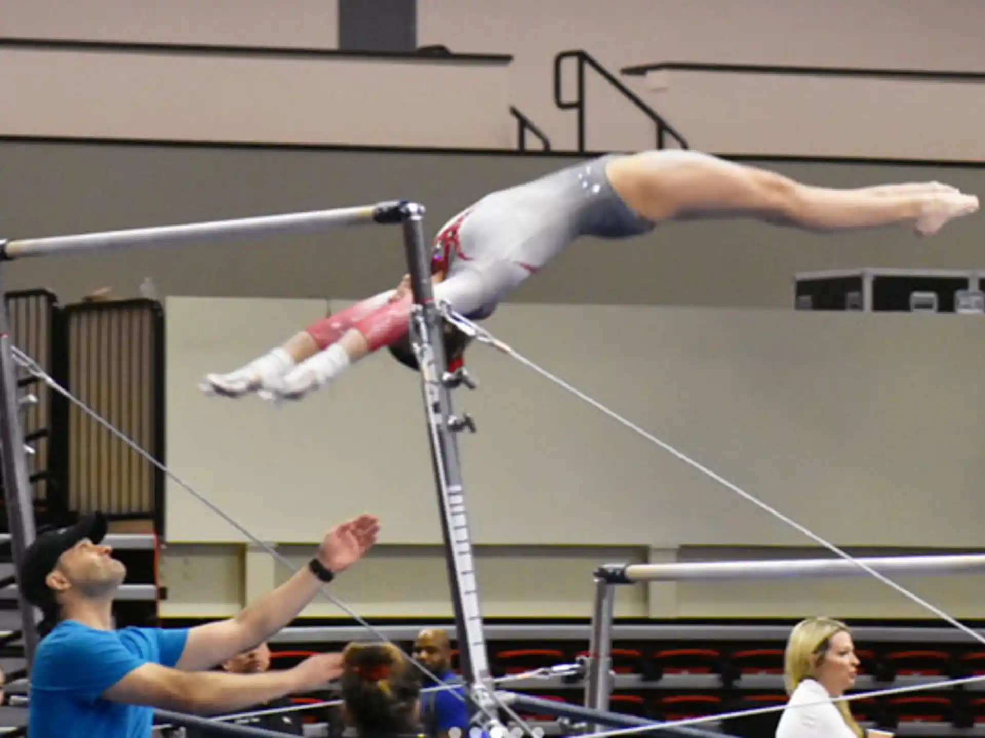 a person jumping over a bar