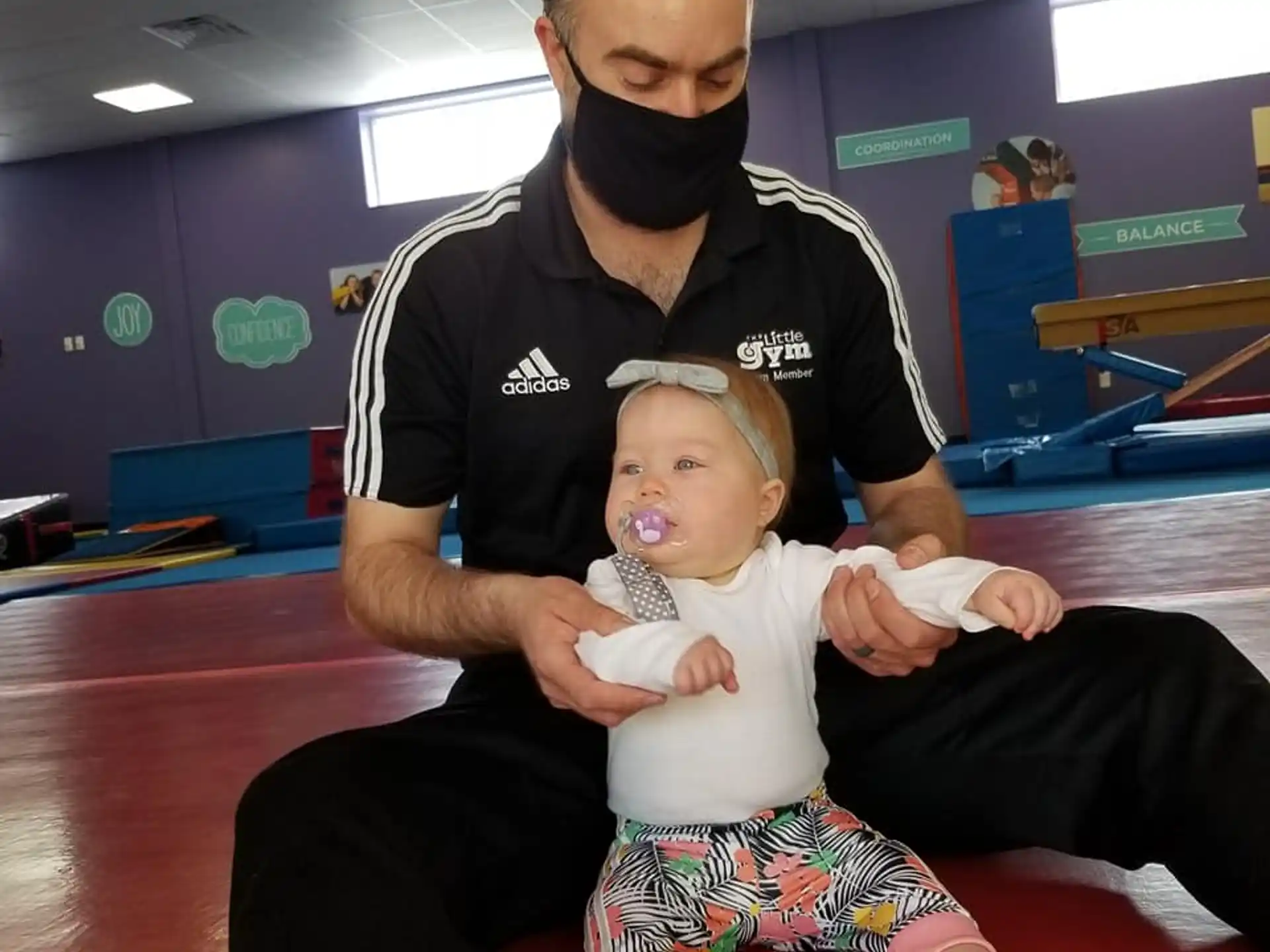 a man holding a baby