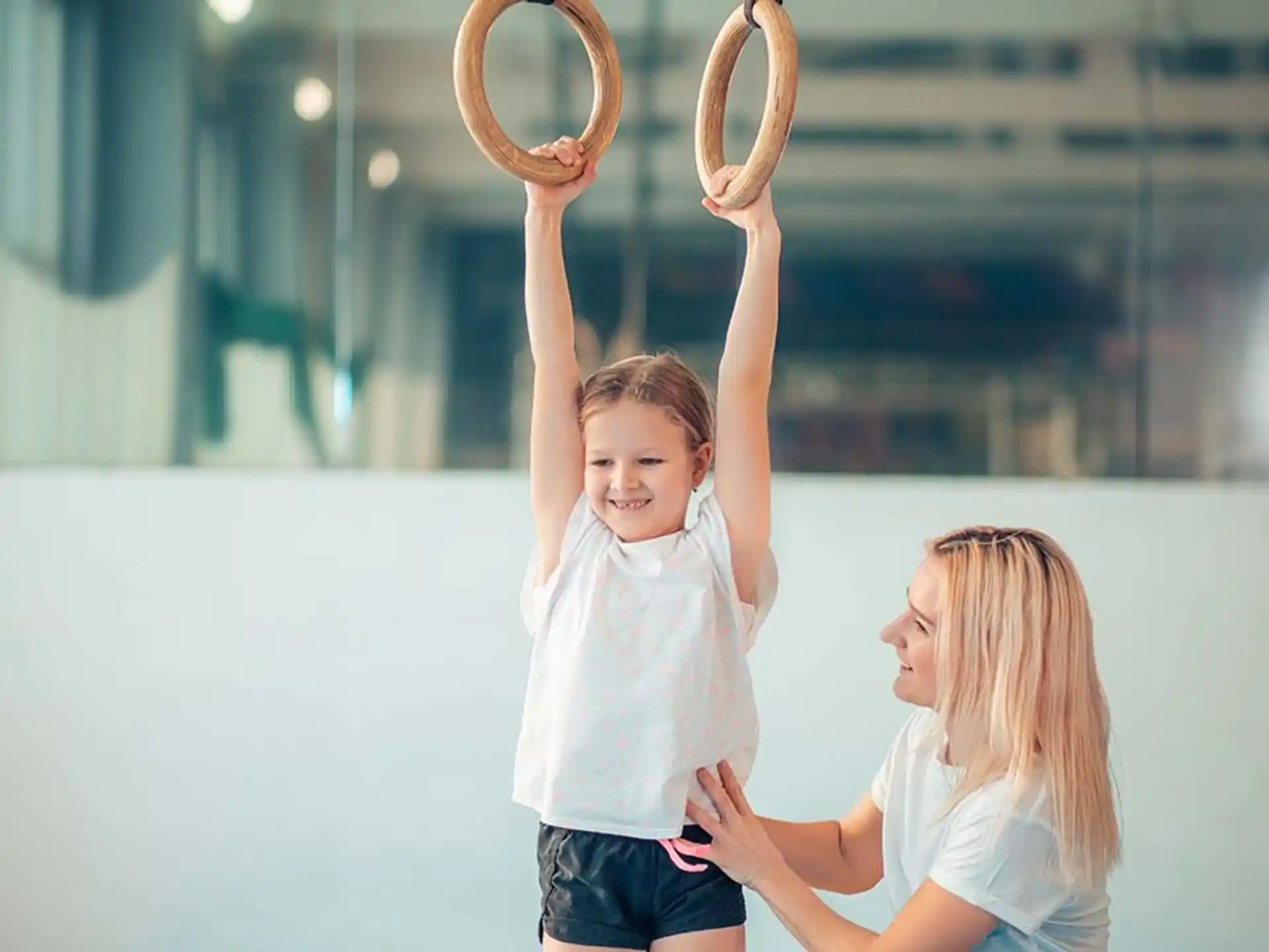a person and a child holding antlers