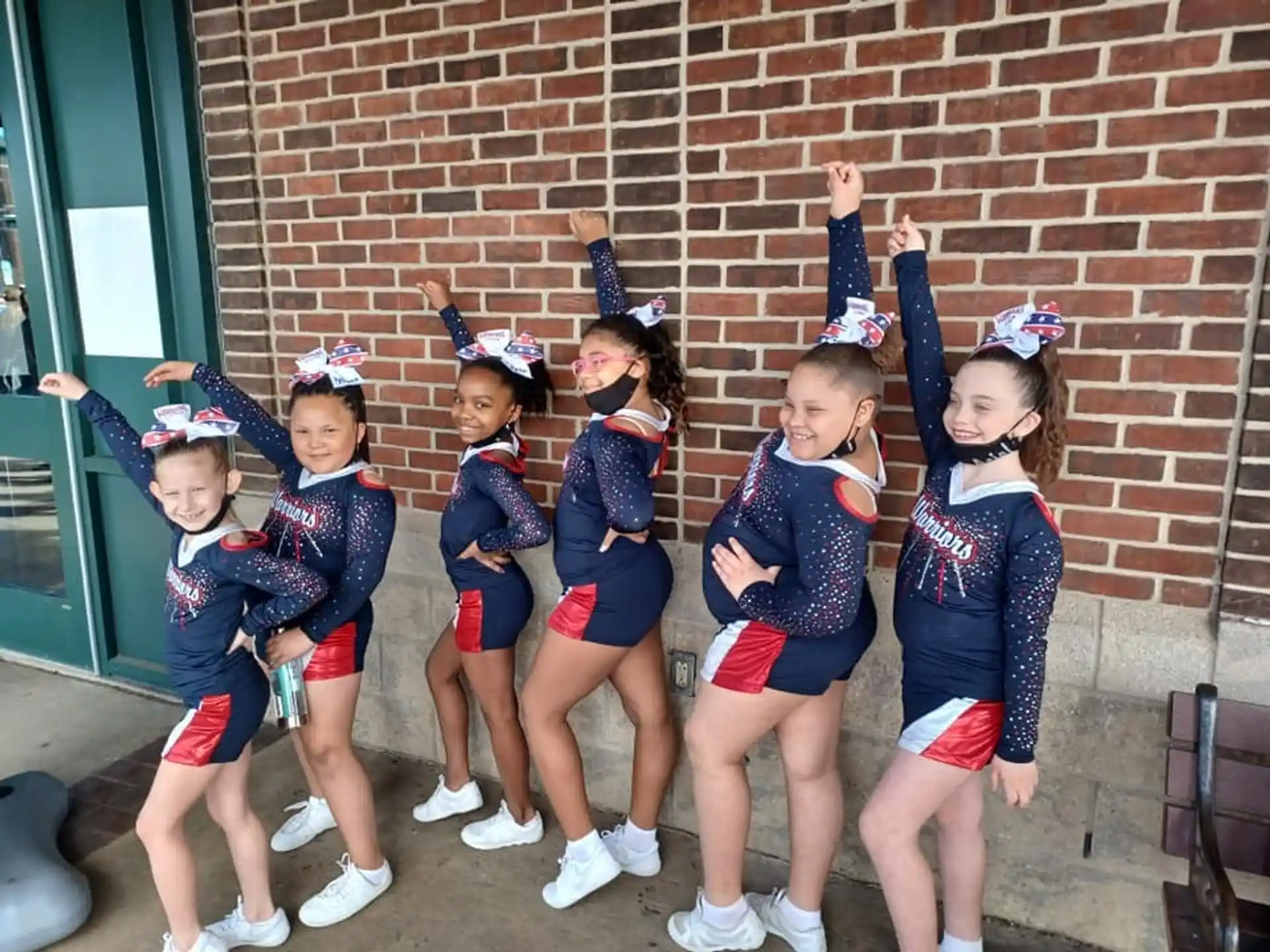 a group of girls in matching uniforms