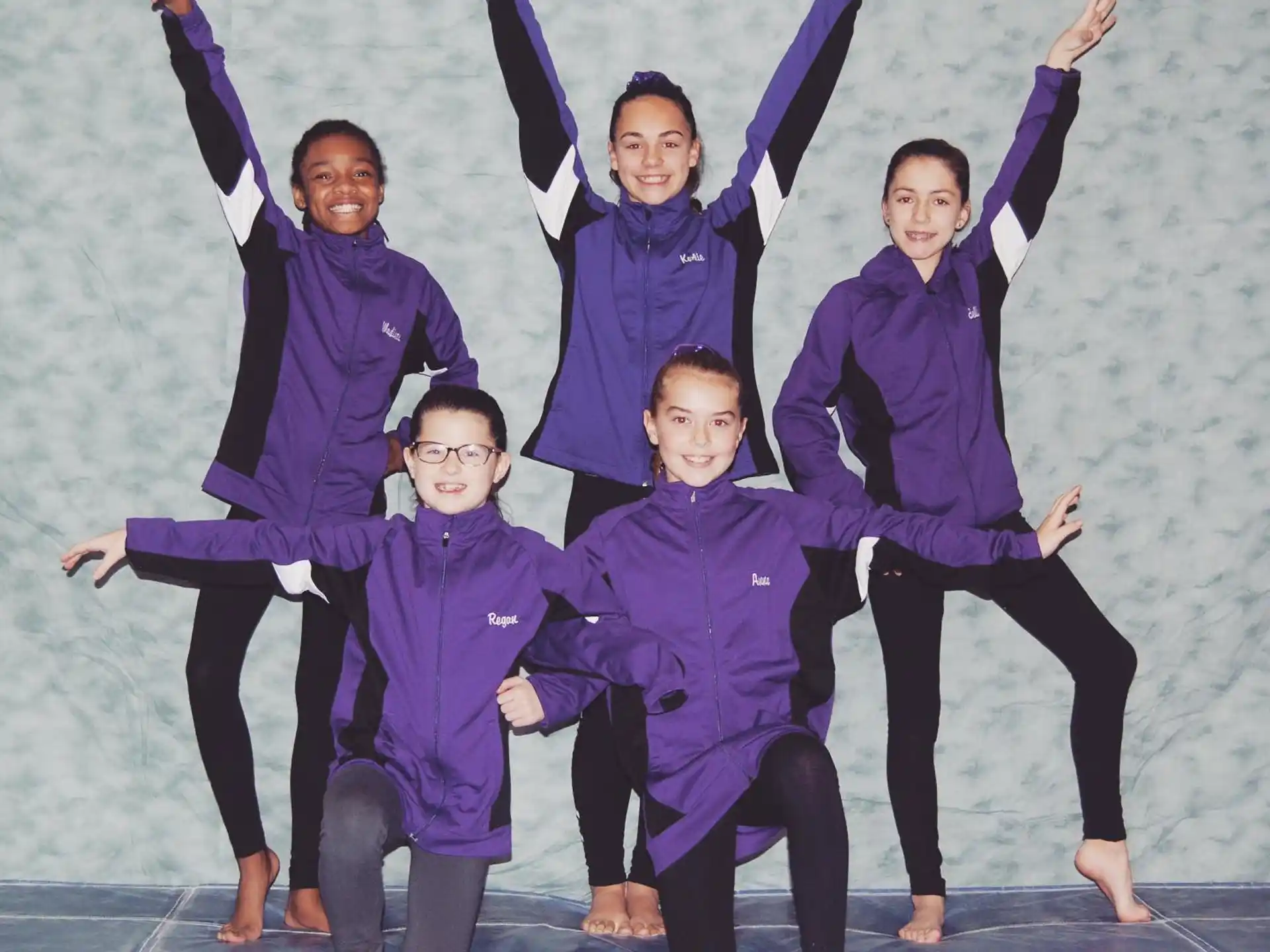 a group of people in purple