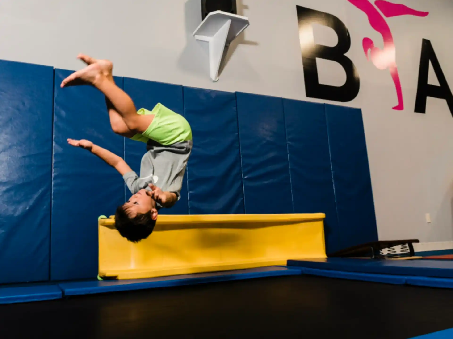 a man doing a handstand on a stage