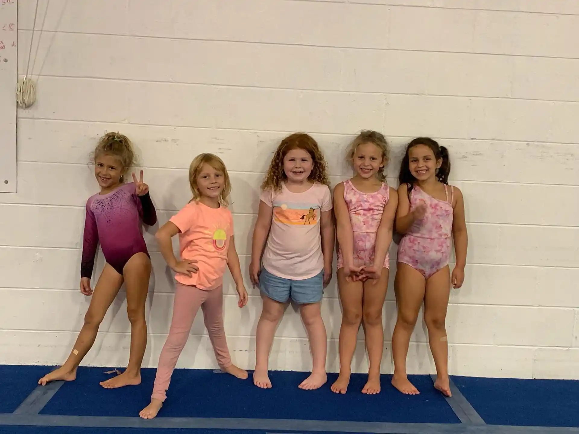 a group of girls posing for a photo