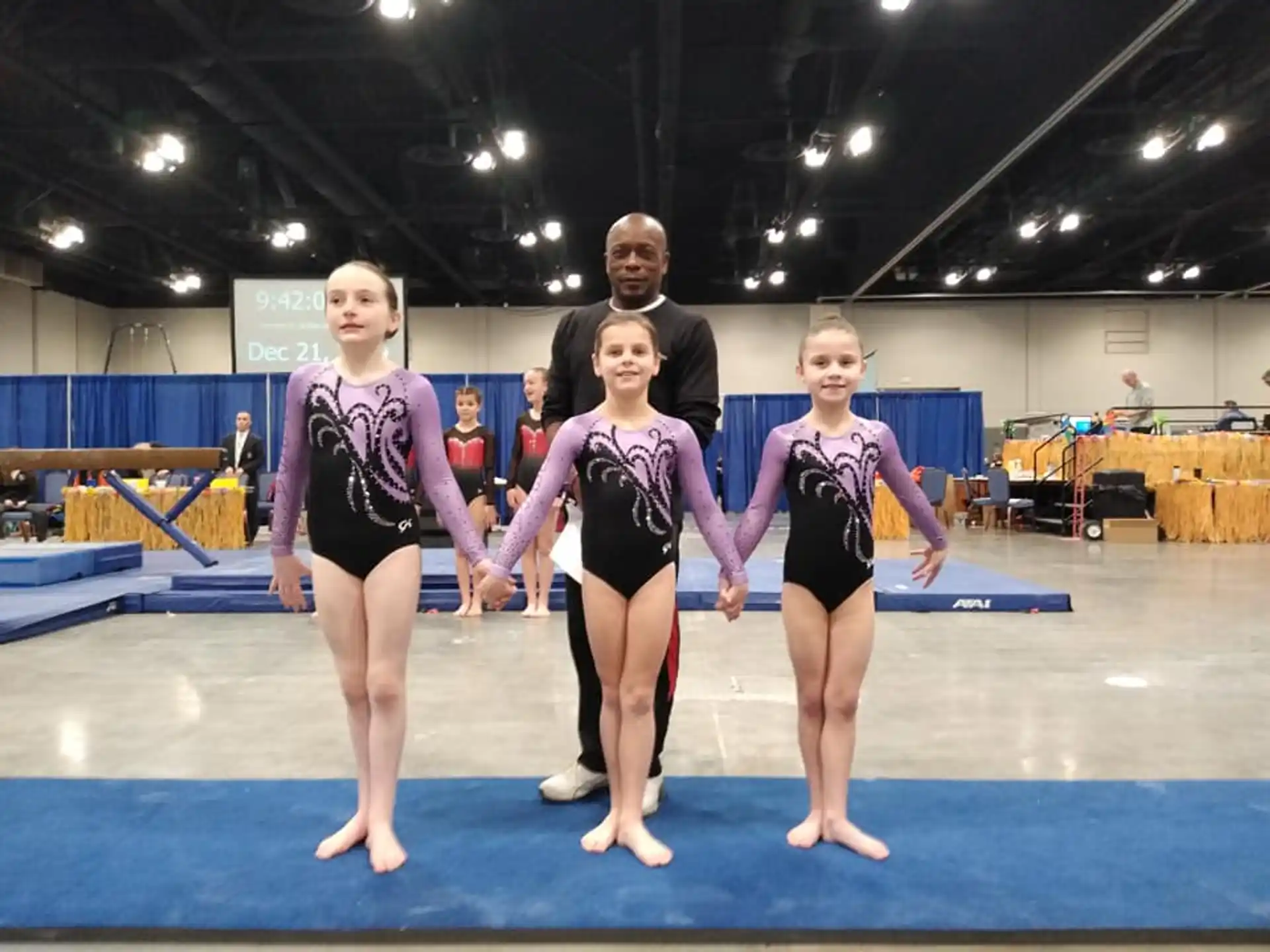 a group of people in leotards posing for a photo