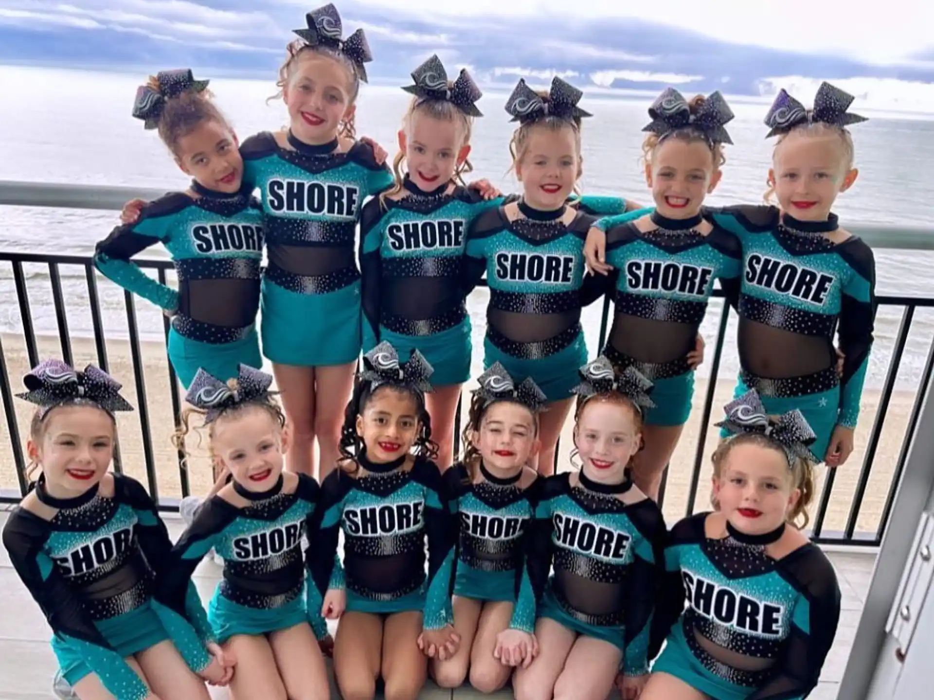 a group of girls wearing matching outfits