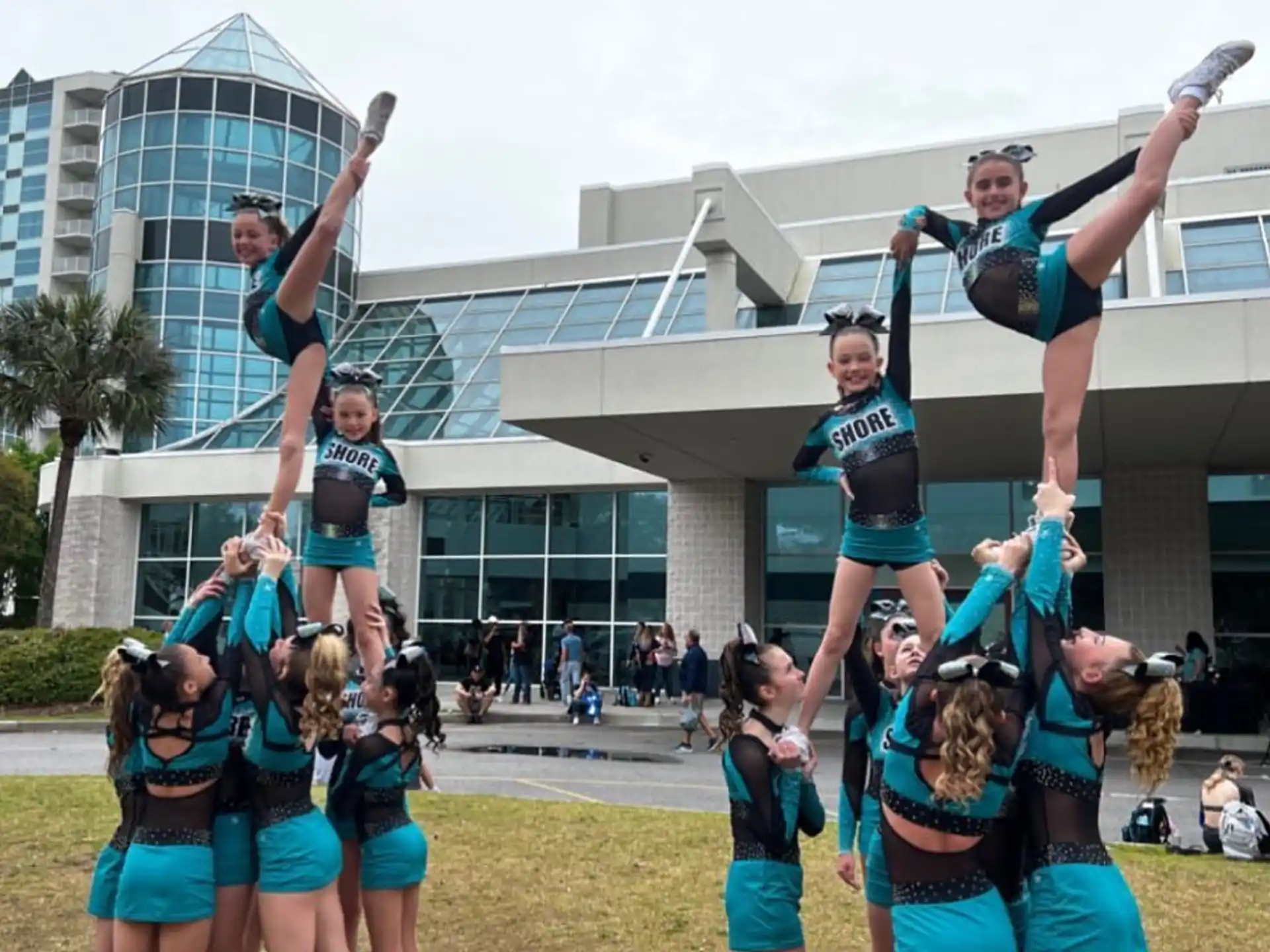 a group of people holding up their hands