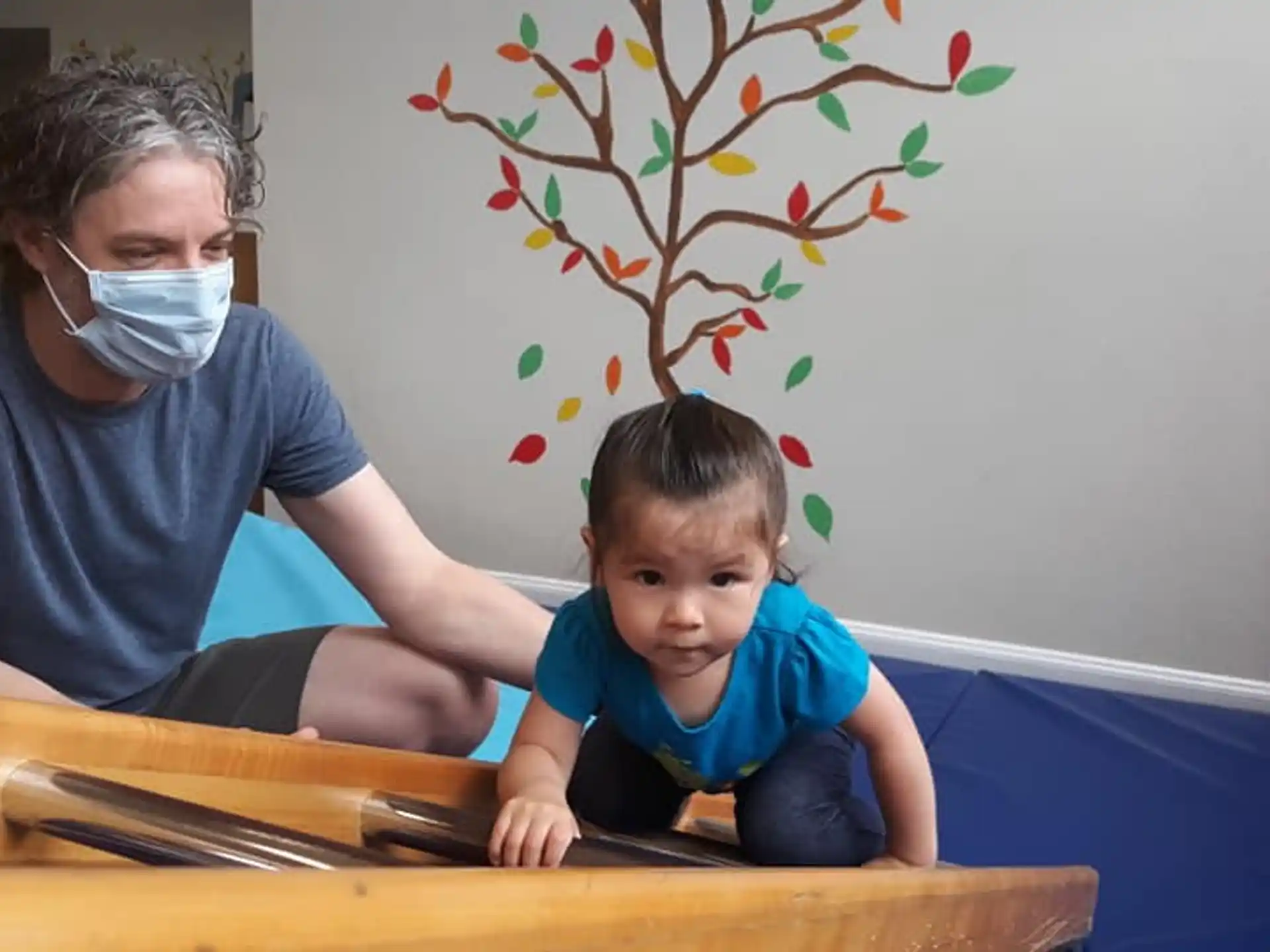 a person and a child wearing face masks