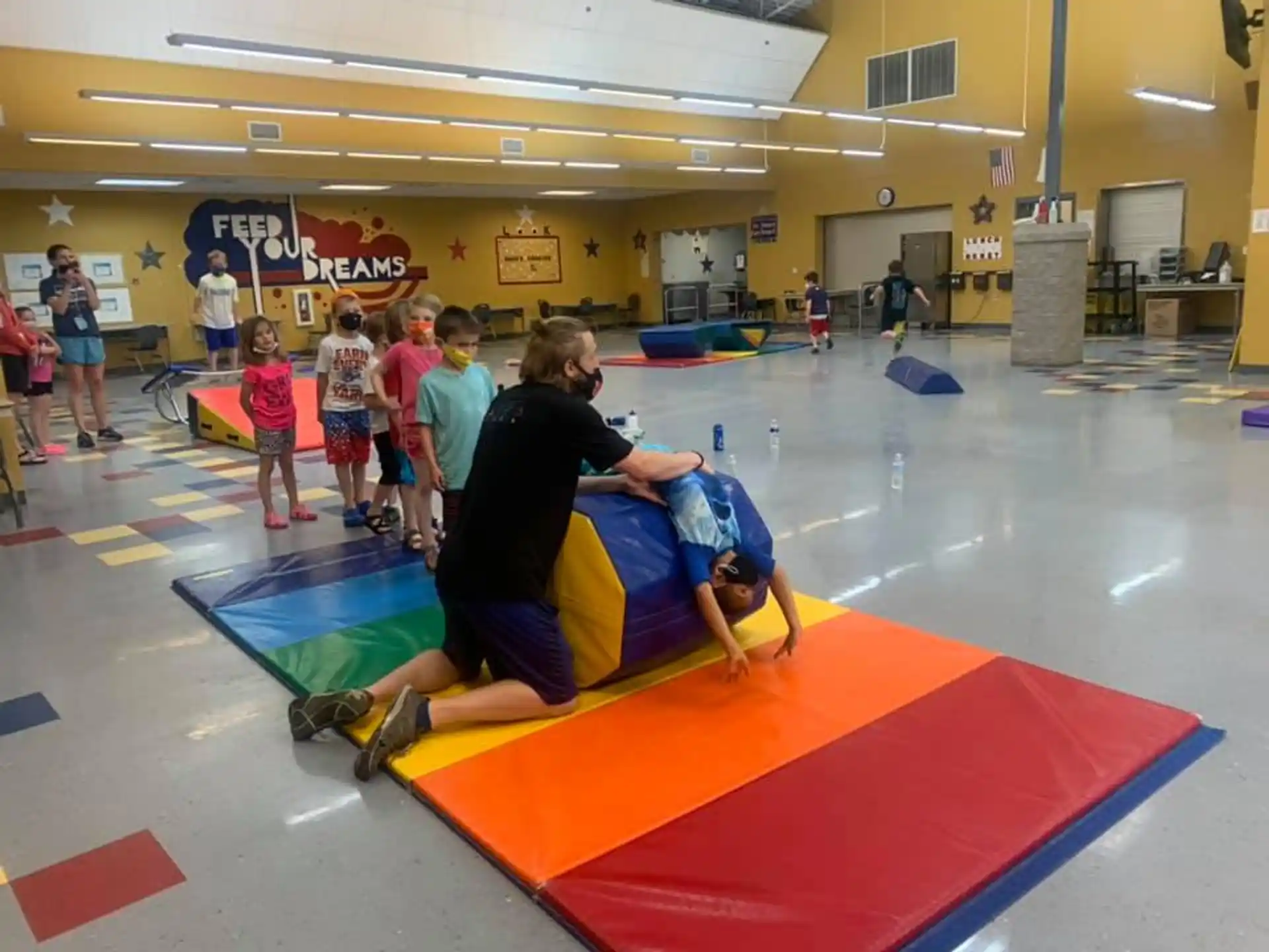 a group of people in a gym