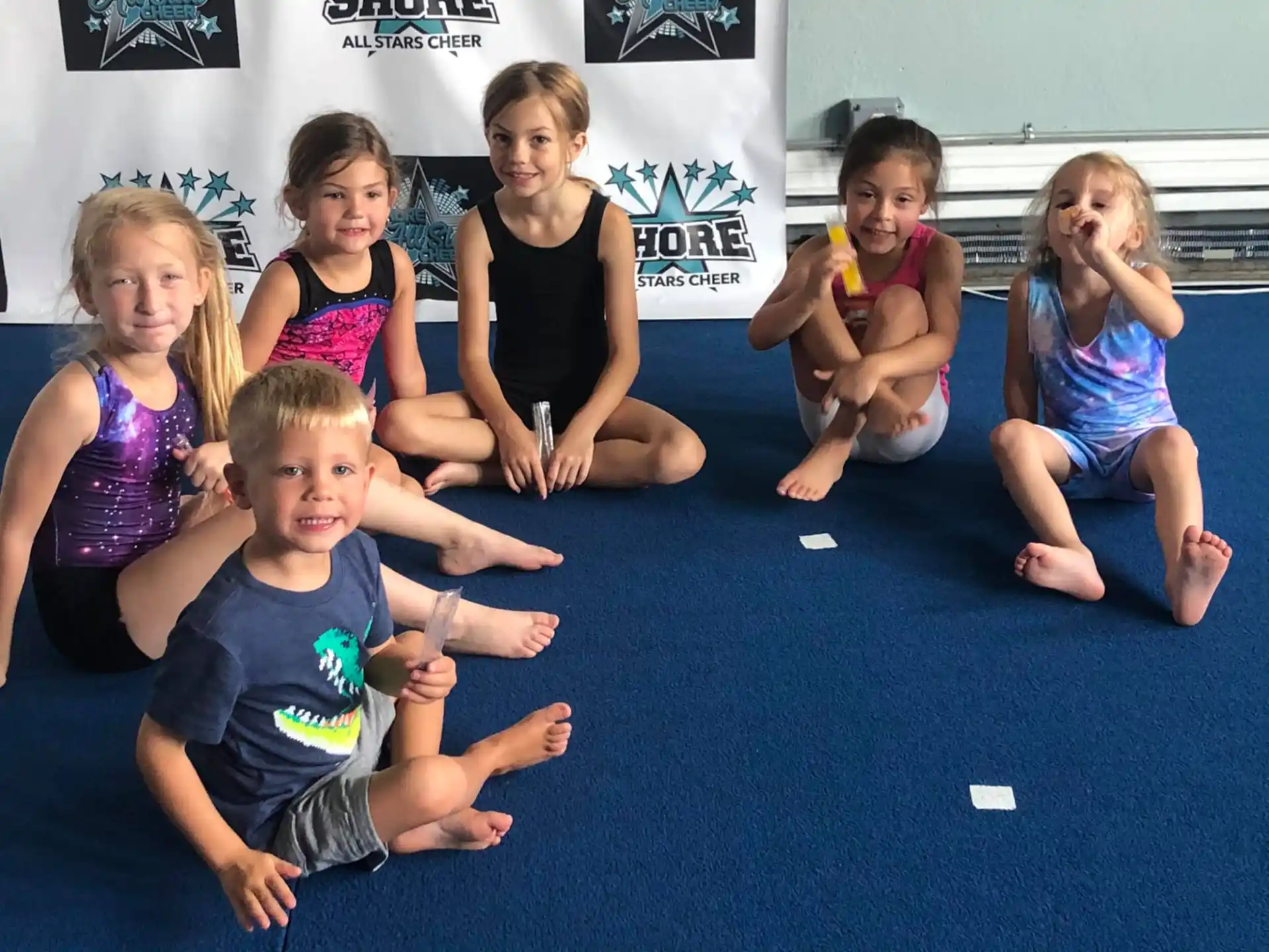 a group of children sitting on the floor