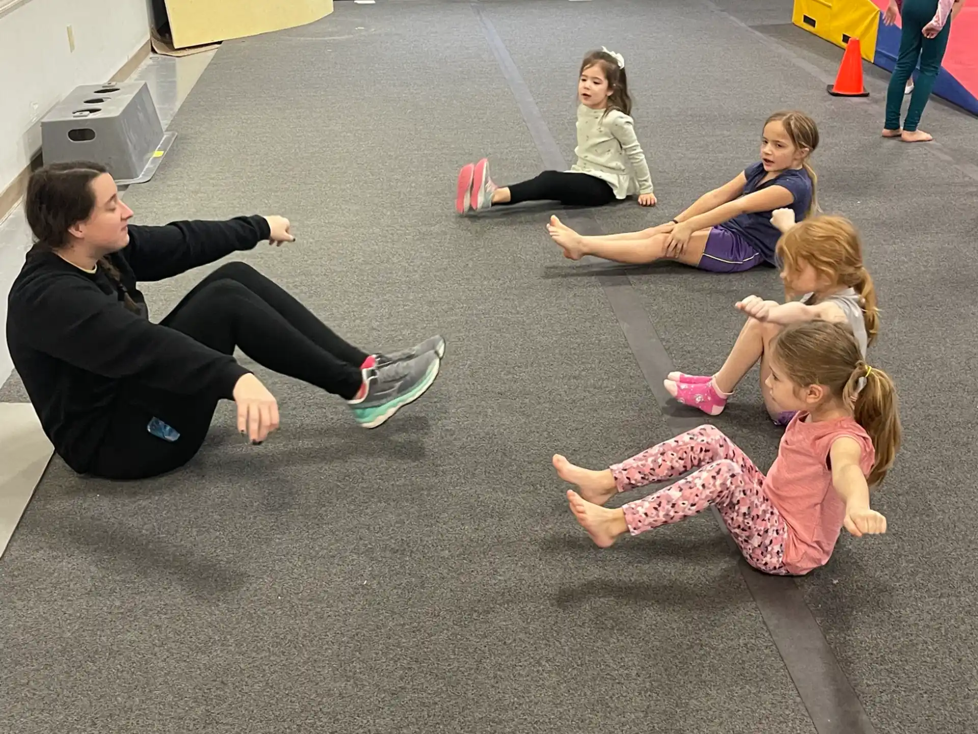 a group of people sitting on the floor