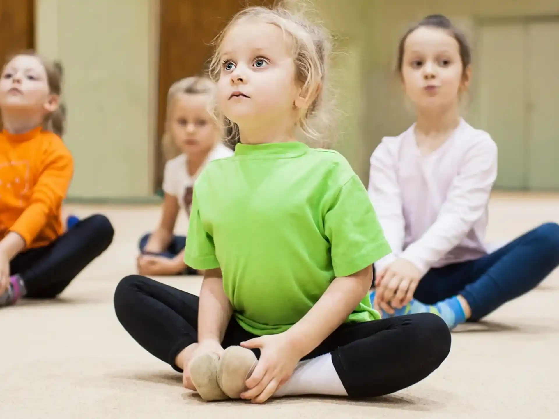 a group of children sitting on the floor