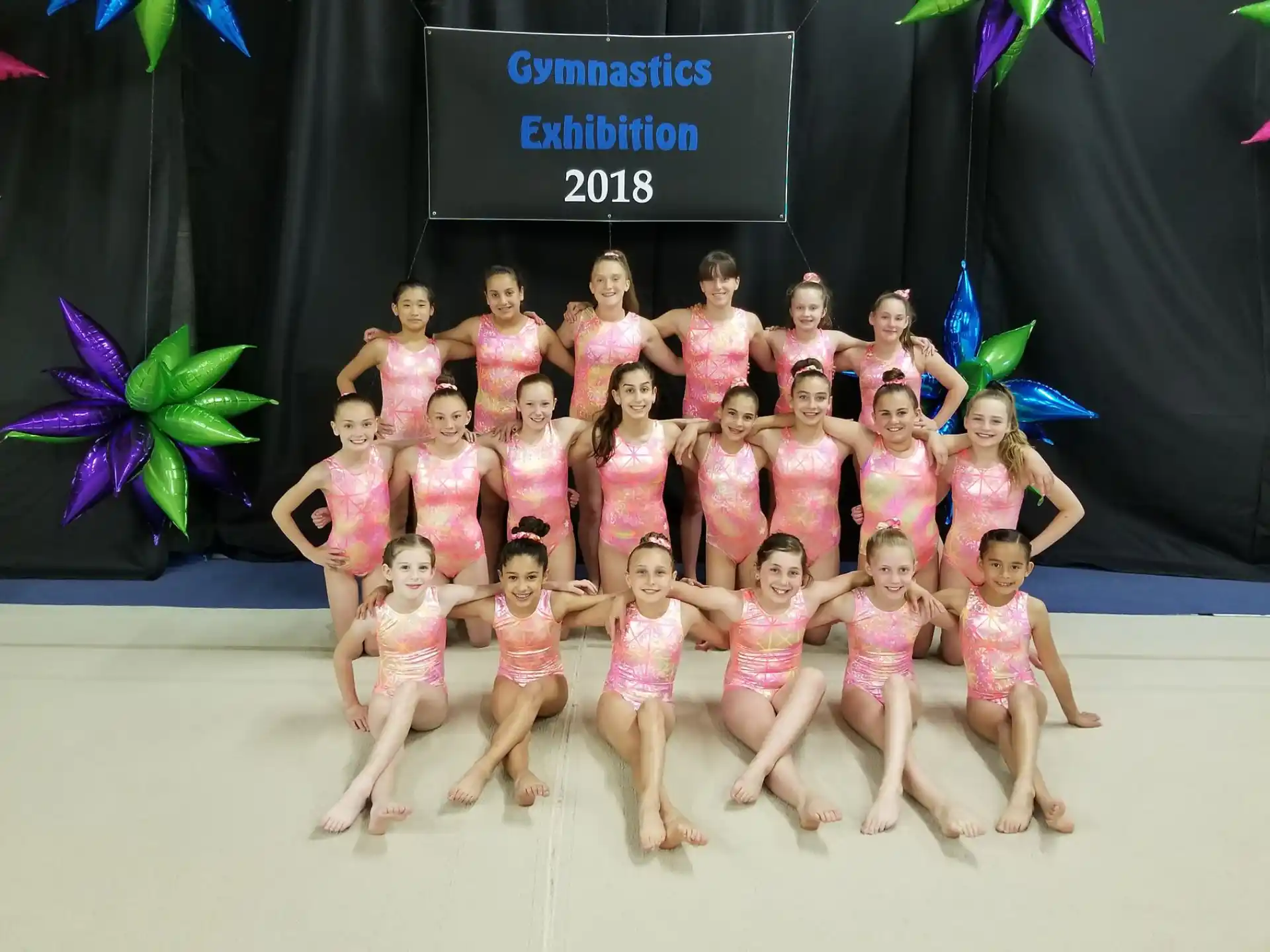 a group of girls posing for a photo
