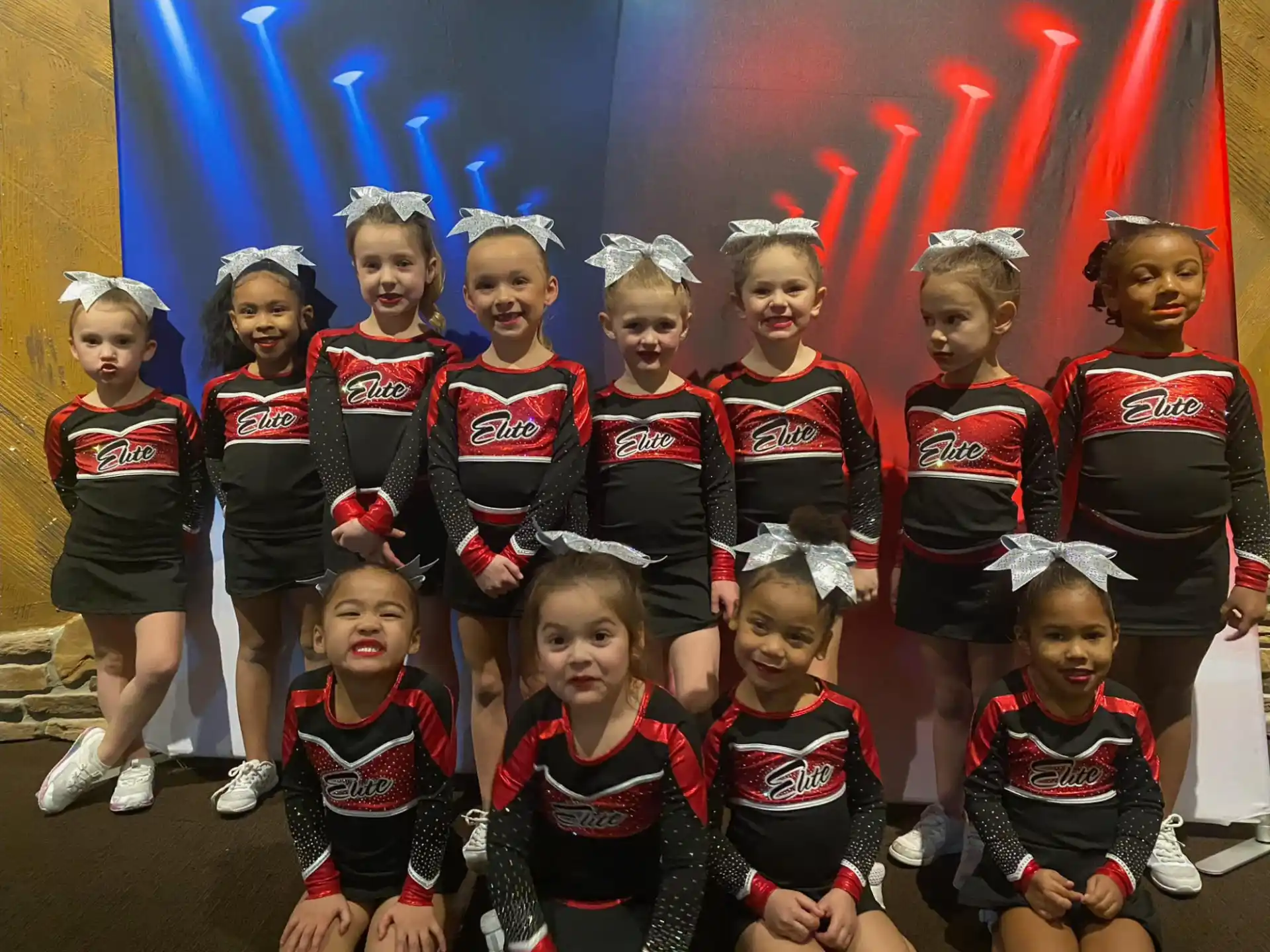 a group of girls in matching outfits