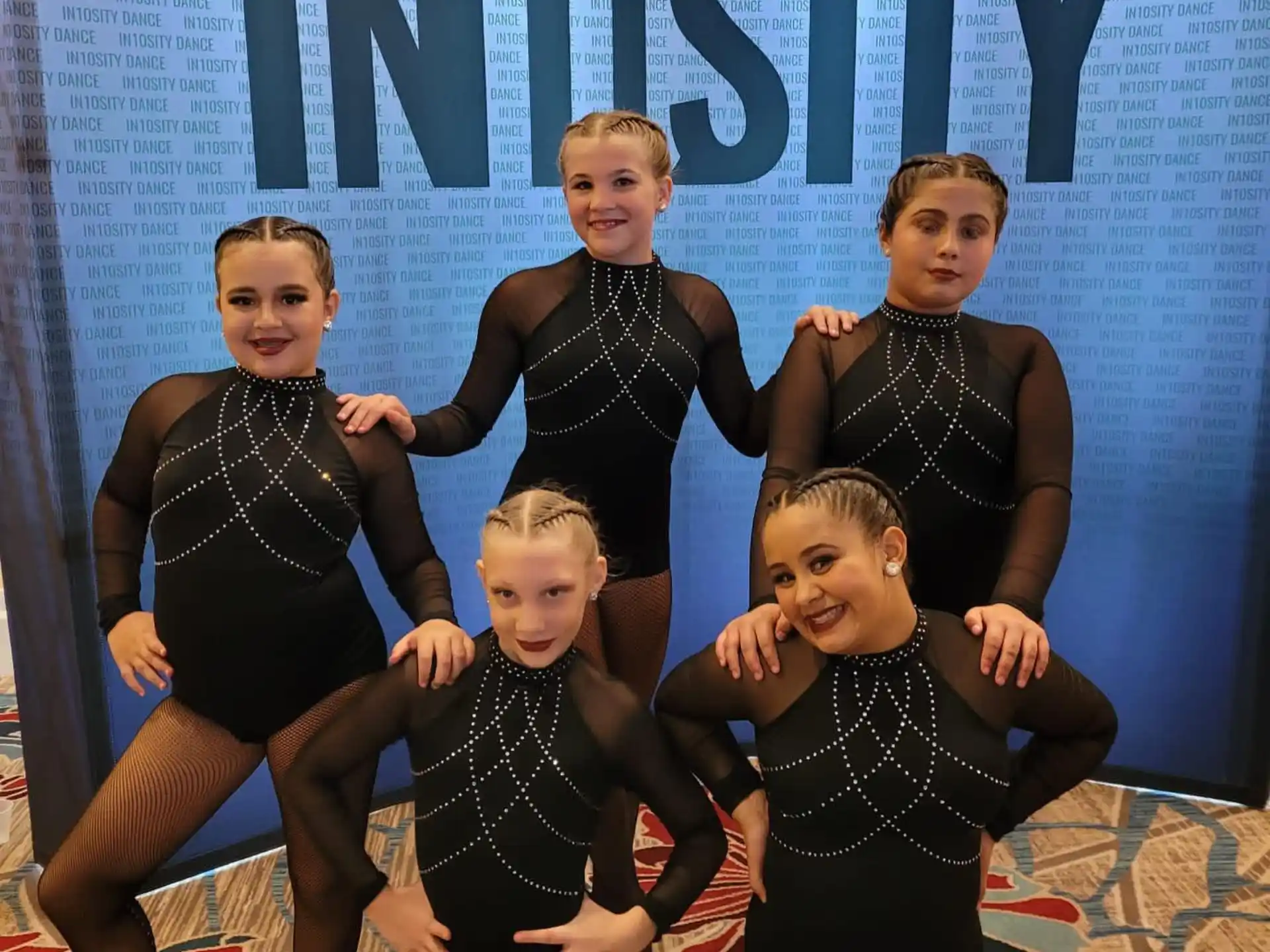 a group of girls posing for a picture