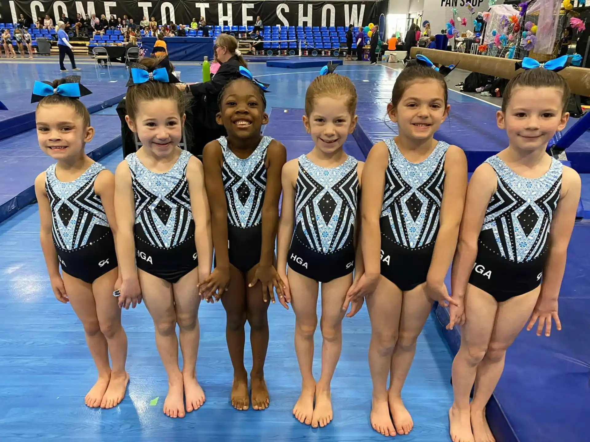 a group of children in swimsuits in a pool