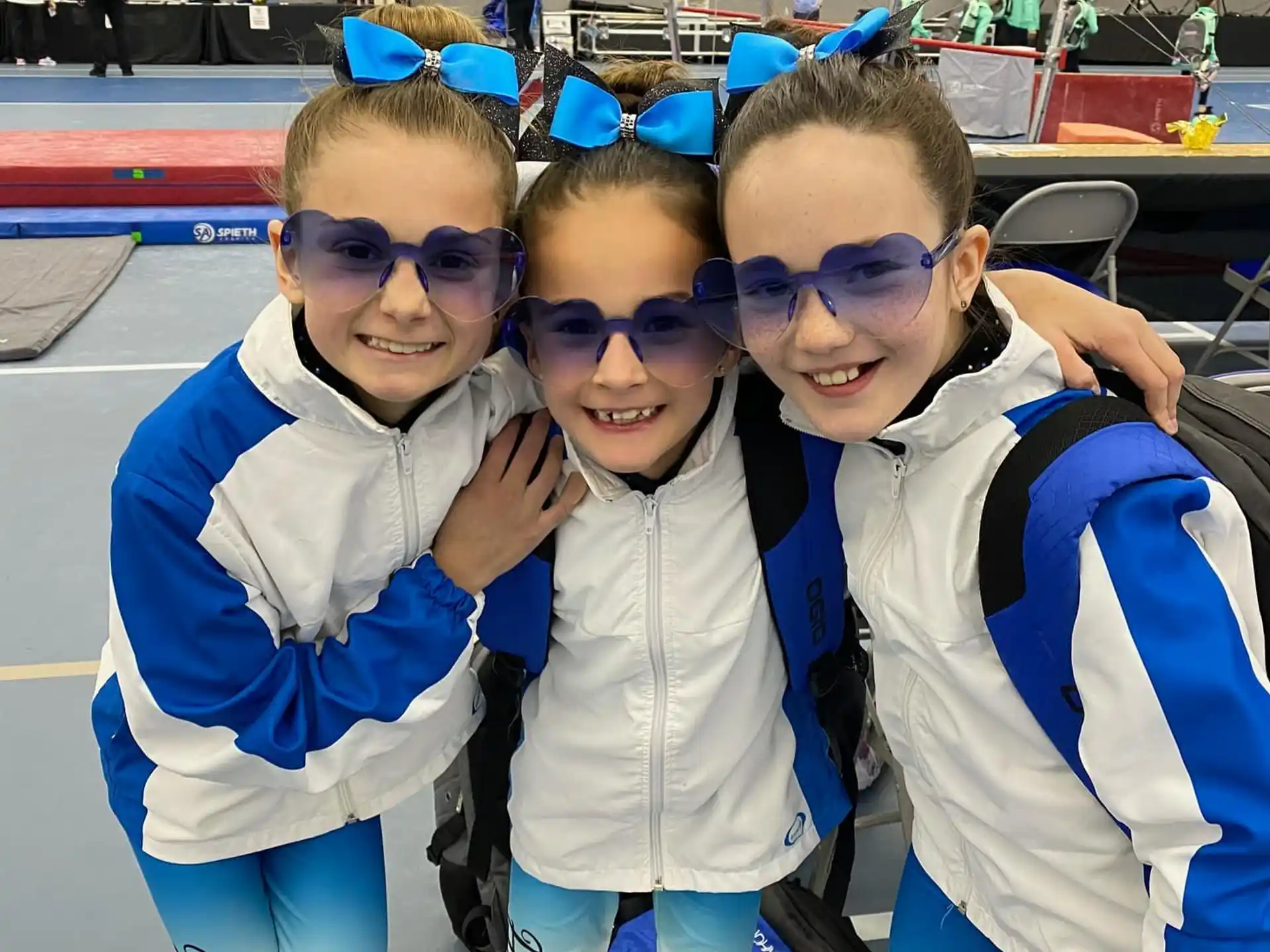 a group of kids wearing blue and white clothing
