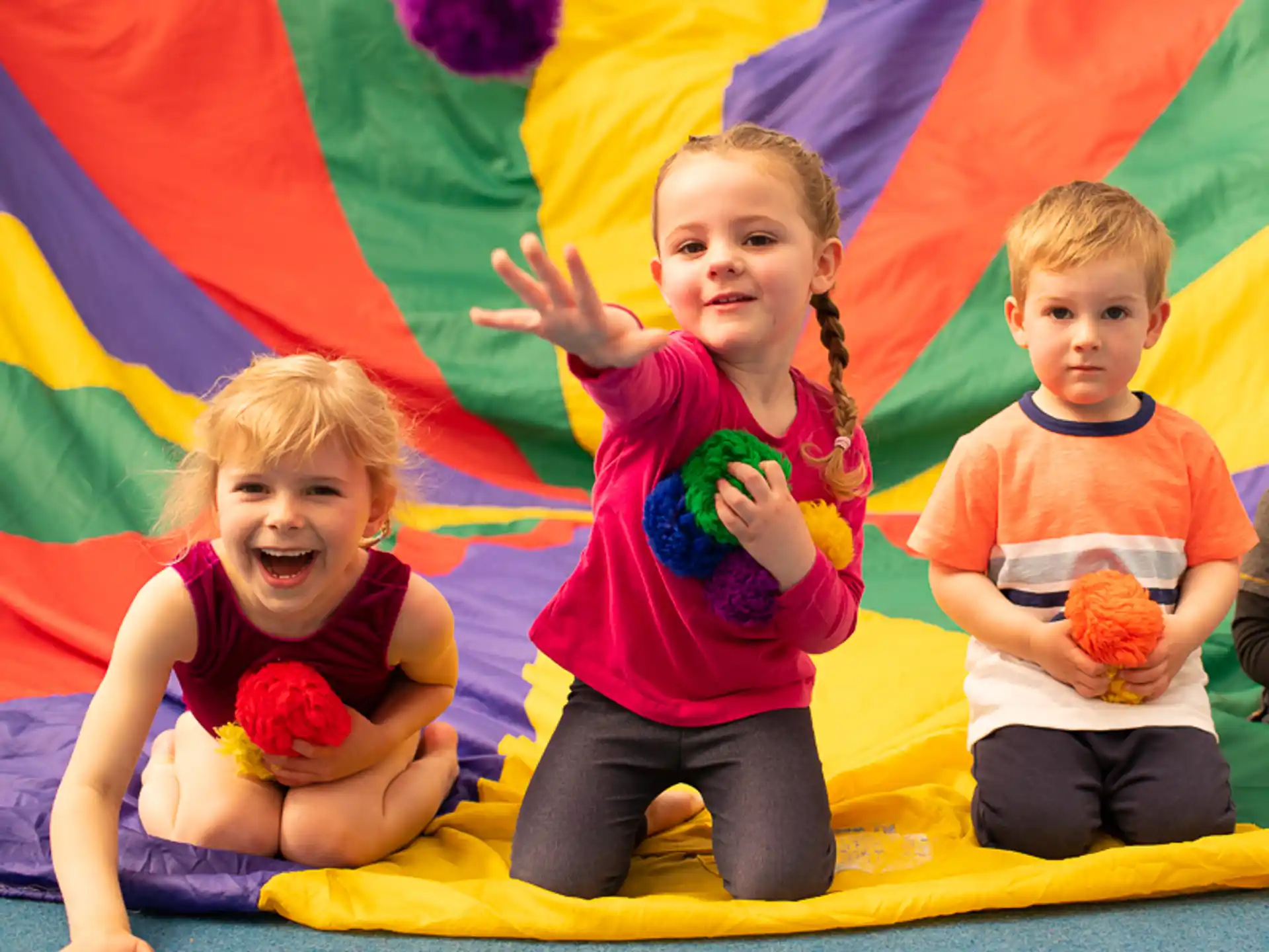 children sitting on a mat