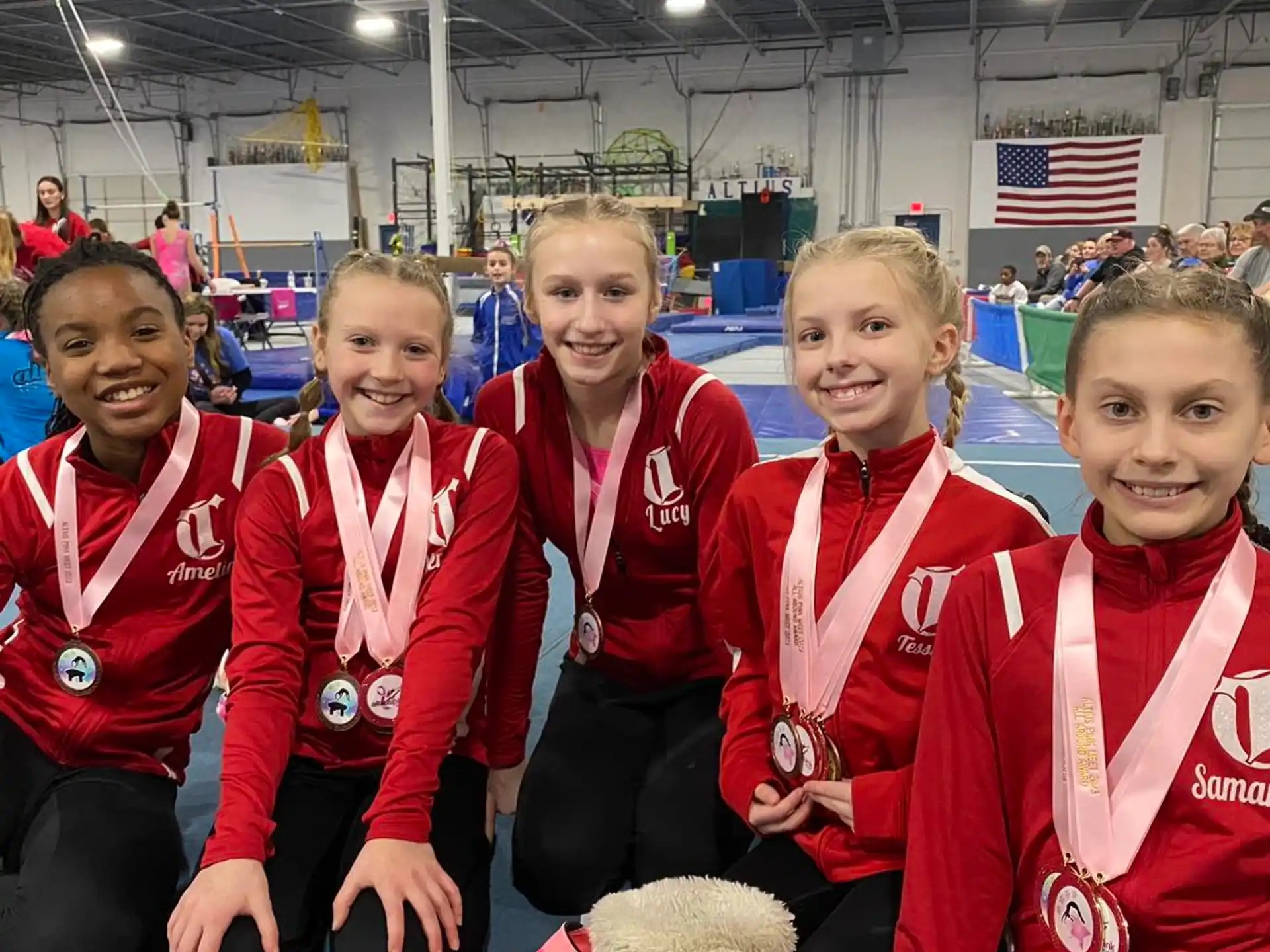 a group of girls in red uniforms