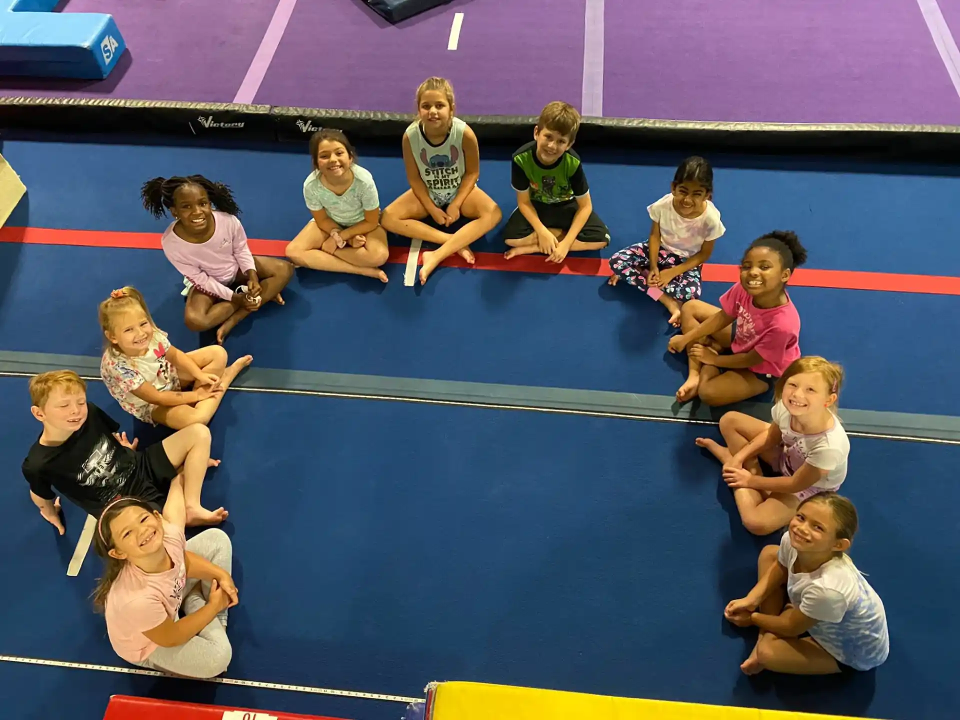 a group of people sitting on a mat