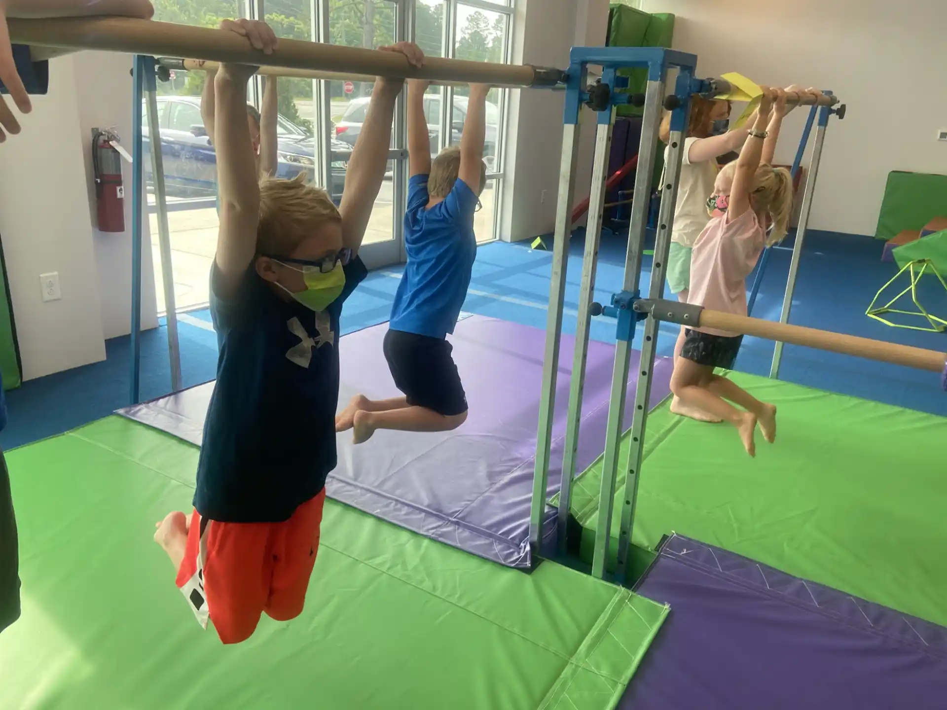 a group of children playing on a trampoline