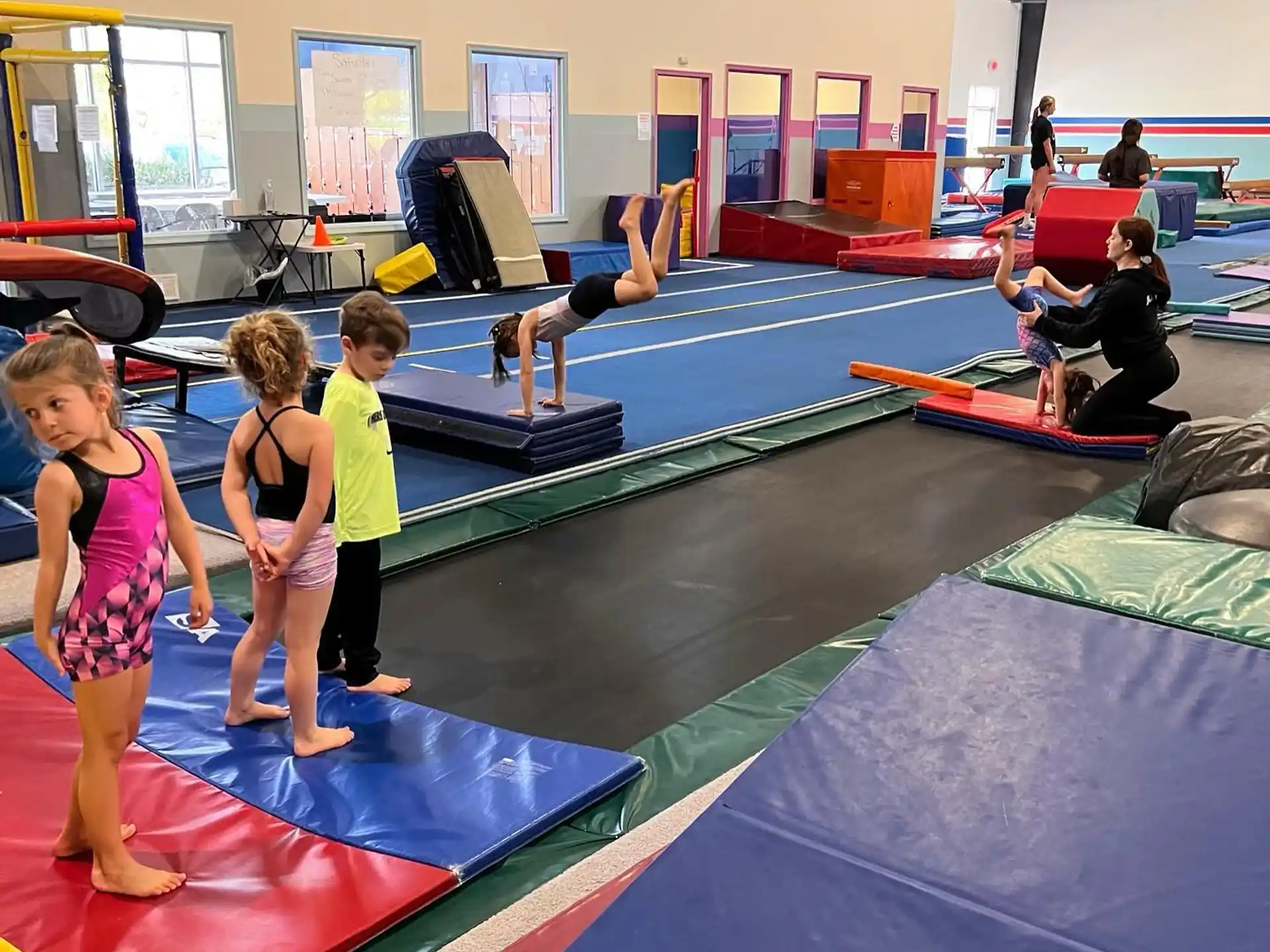 a group of children playing on mats