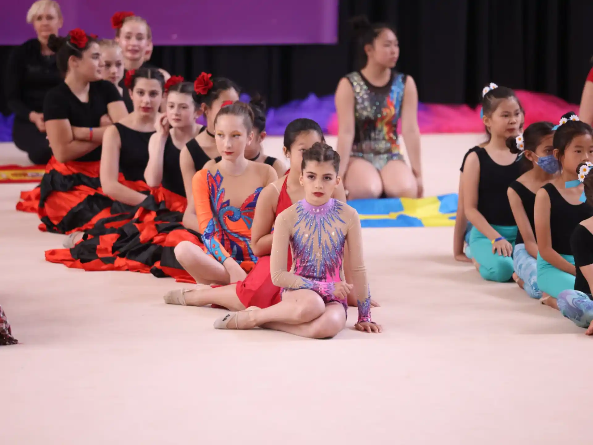 a group of children sitting on the floor