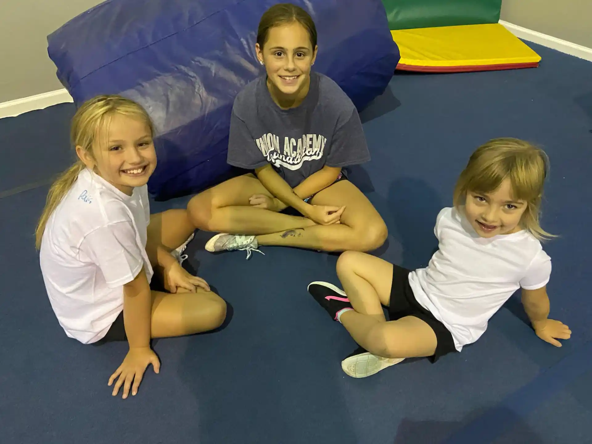 a group of children sitting on the floor