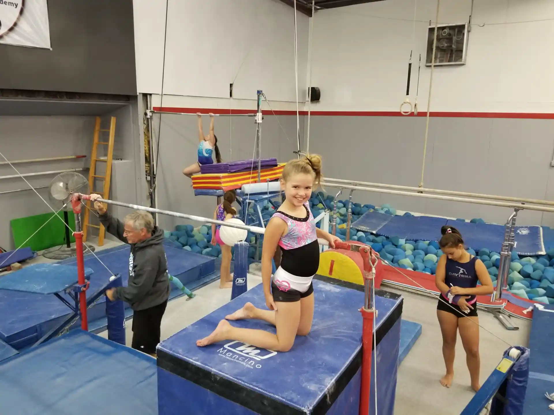 a girl in a swimsuit on a trampoline
