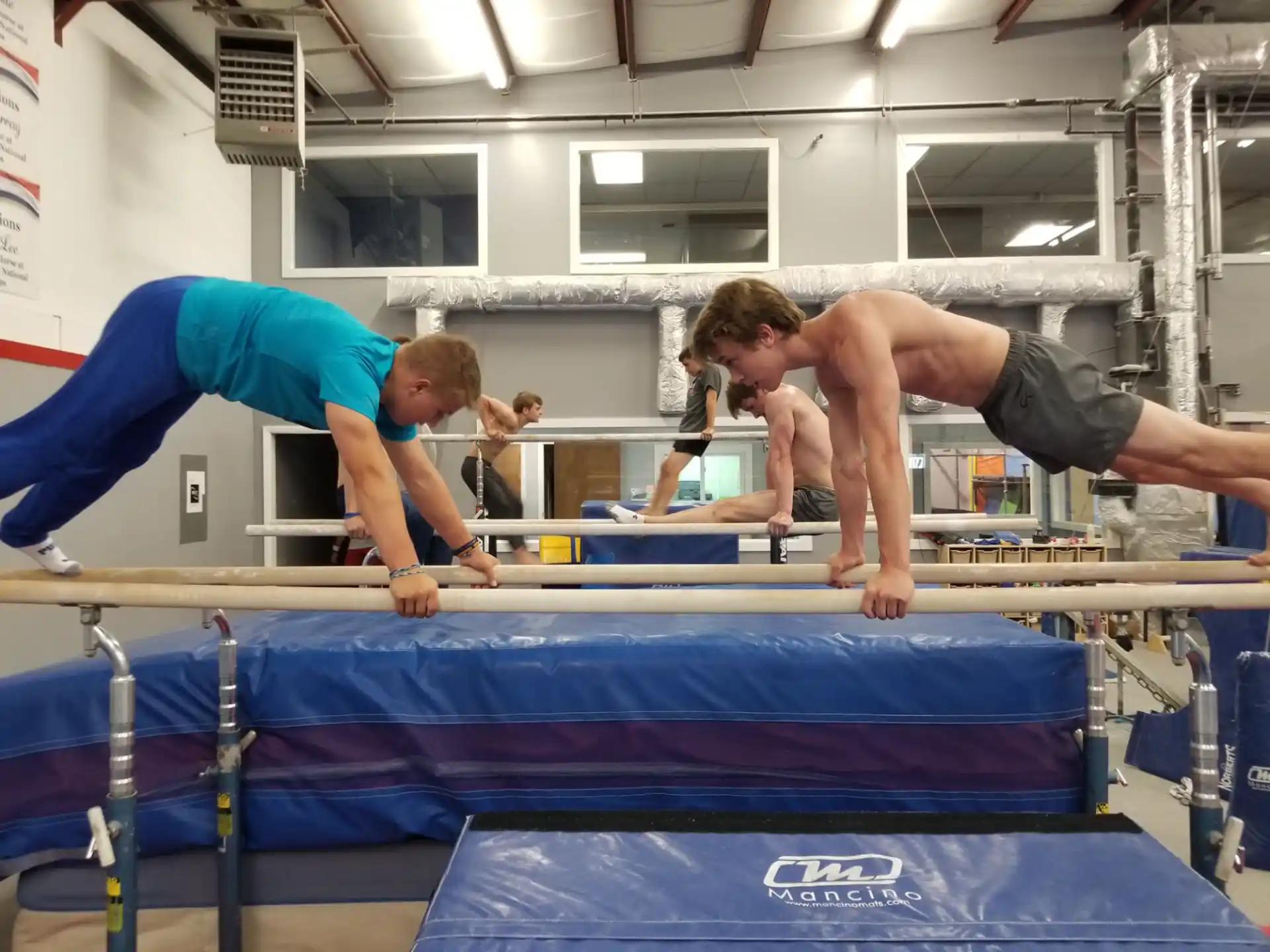 a group of men doing gymnastics