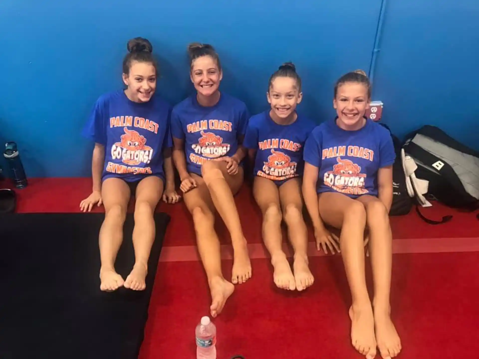 a group of girls wearing matching shirts